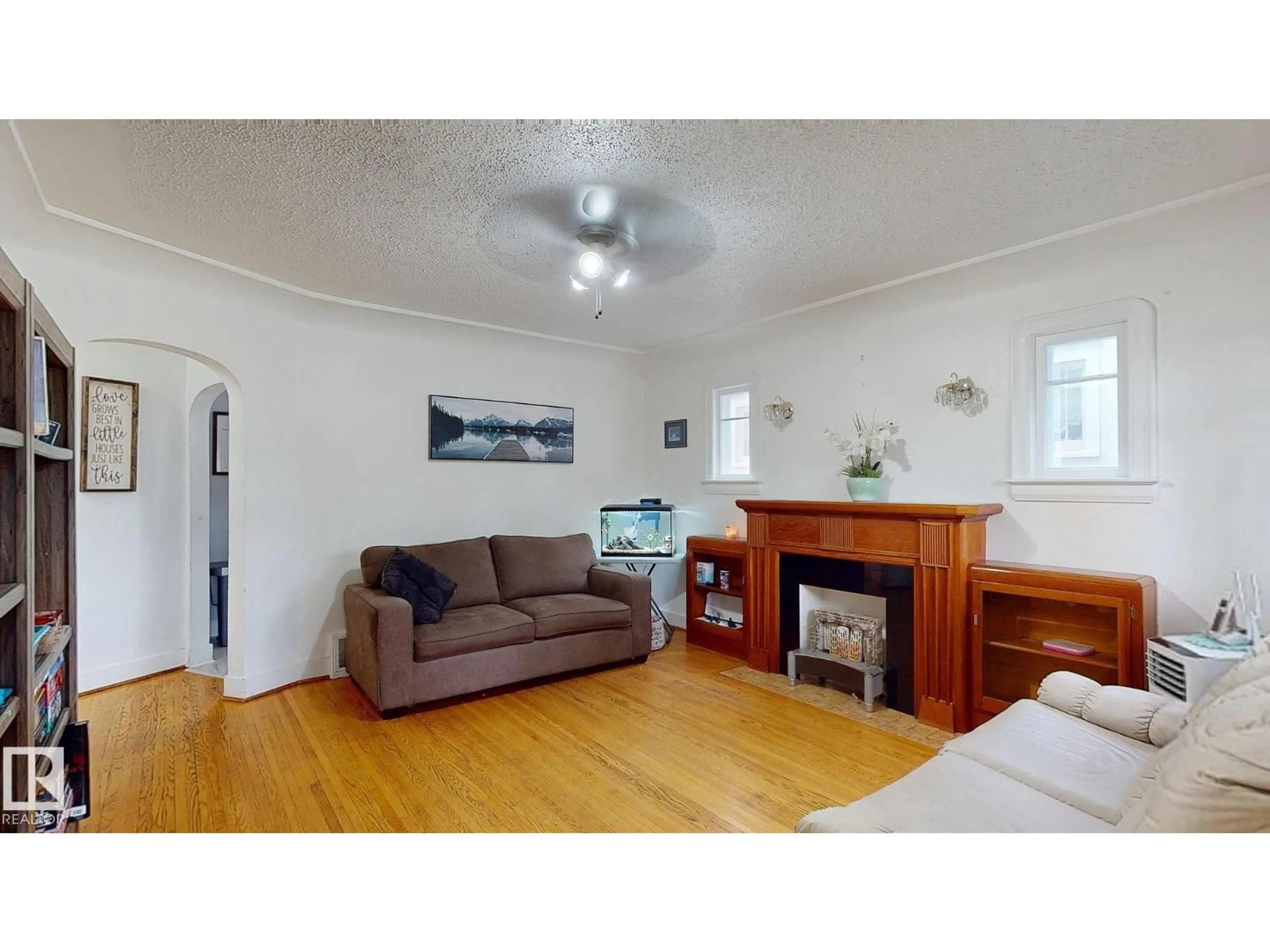 Living room with furniture, wood/laminate floor for NW - 7611 112 AV, Edmonton Alberta T5B0H4