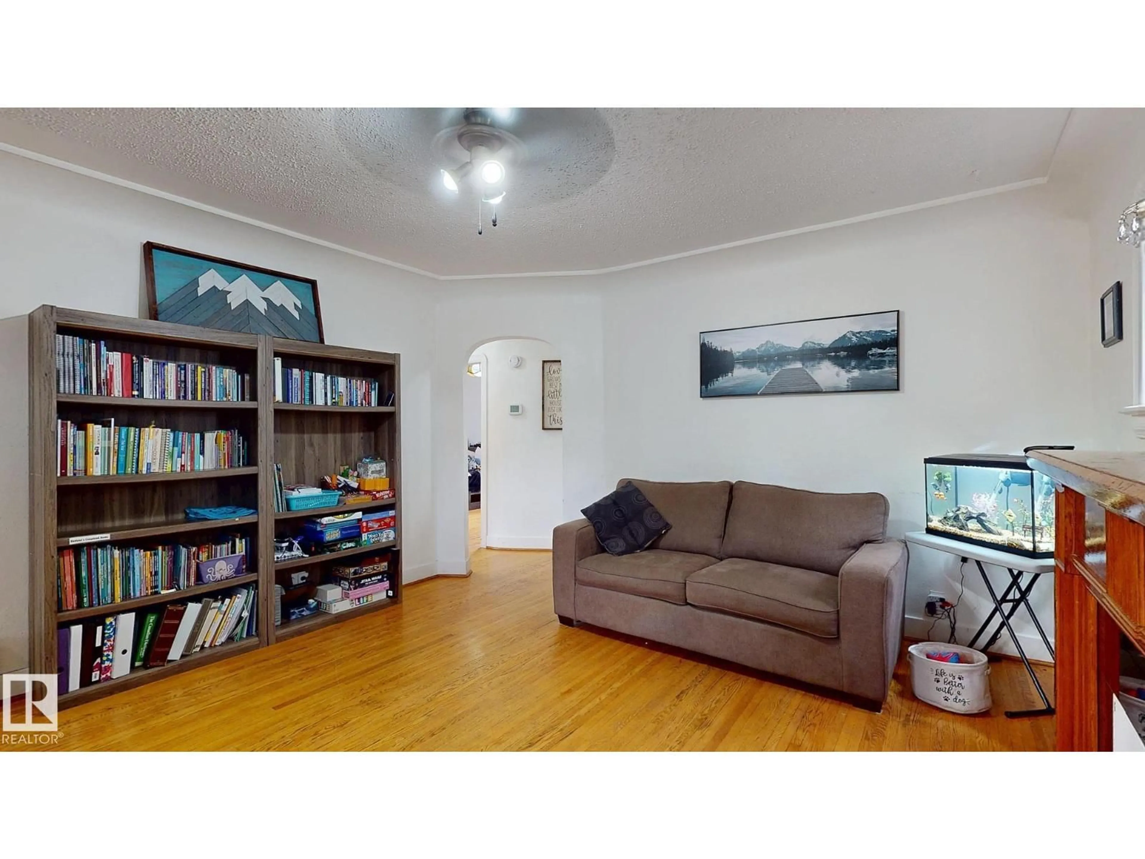 Living room with furniture, wood/laminate floor for NW - 7611 112 AV, Edmonton Alberta T5B0H4