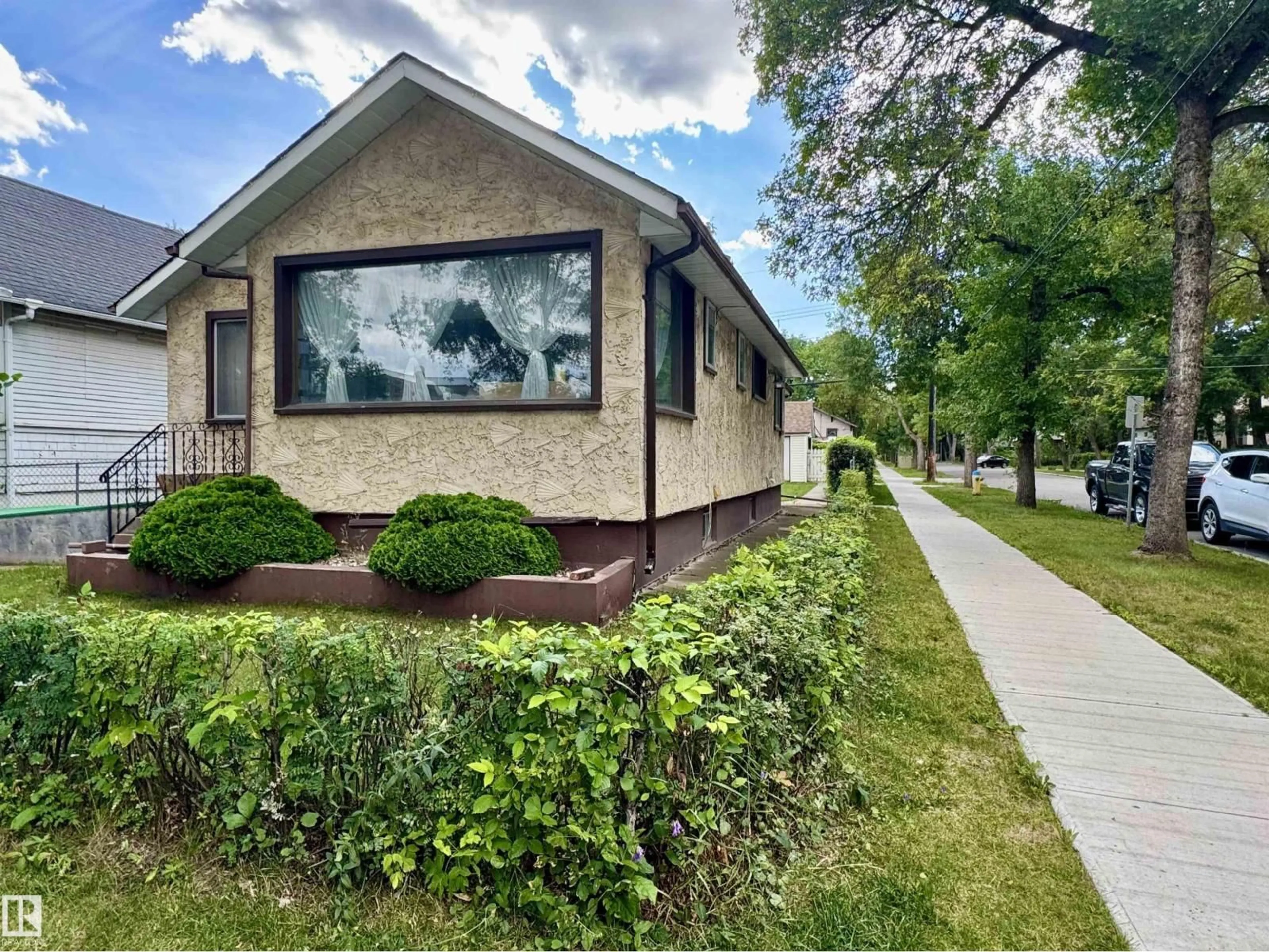 Home with vinyl exterior material, street for 11936 94 ST, Edmonton Alberta T5G1J5