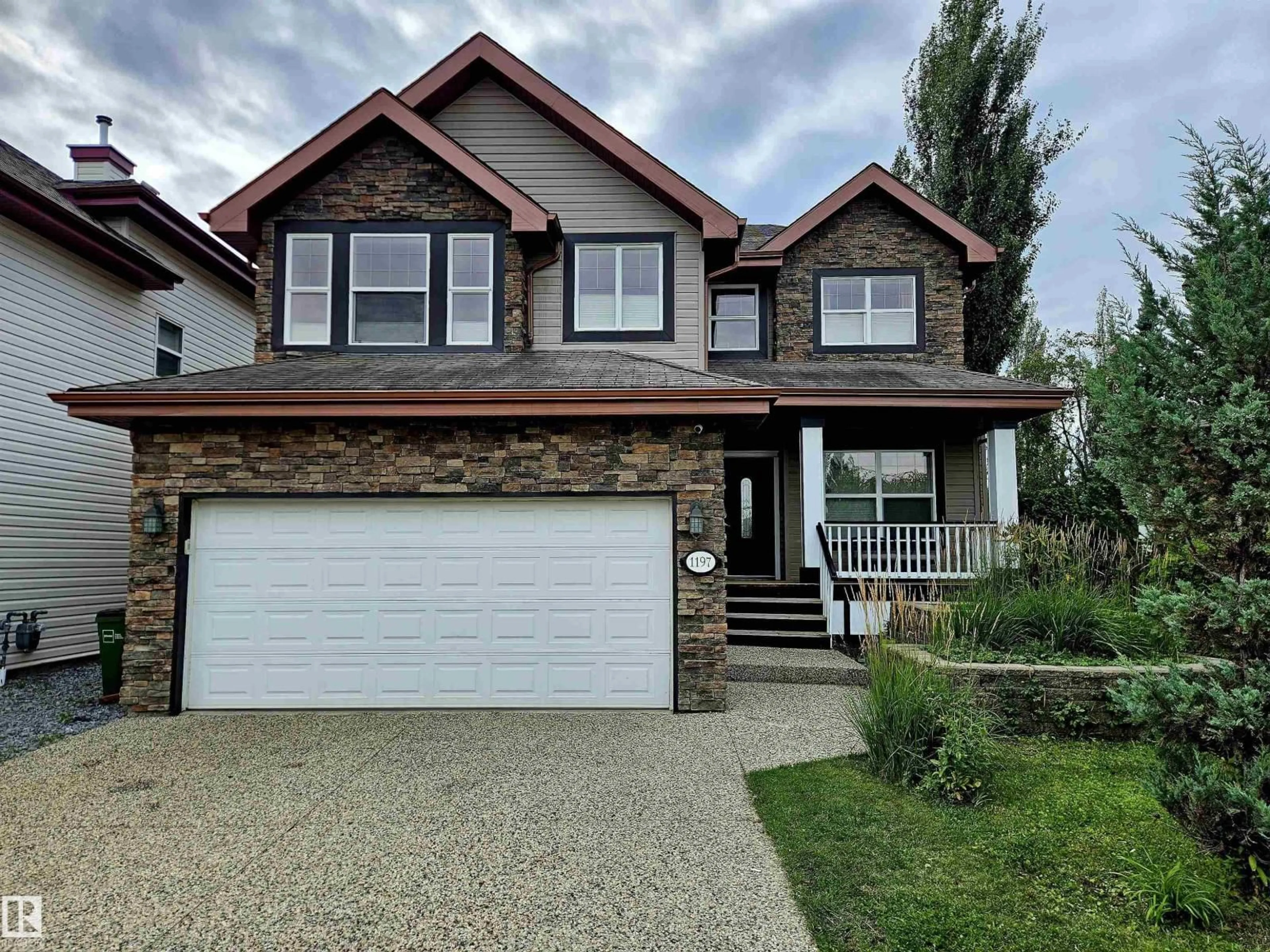 Home with vinyl exterior material, street for CI NW - 1197 GOODWIN CIRCLE, Edmonton Alberta T5T6W4