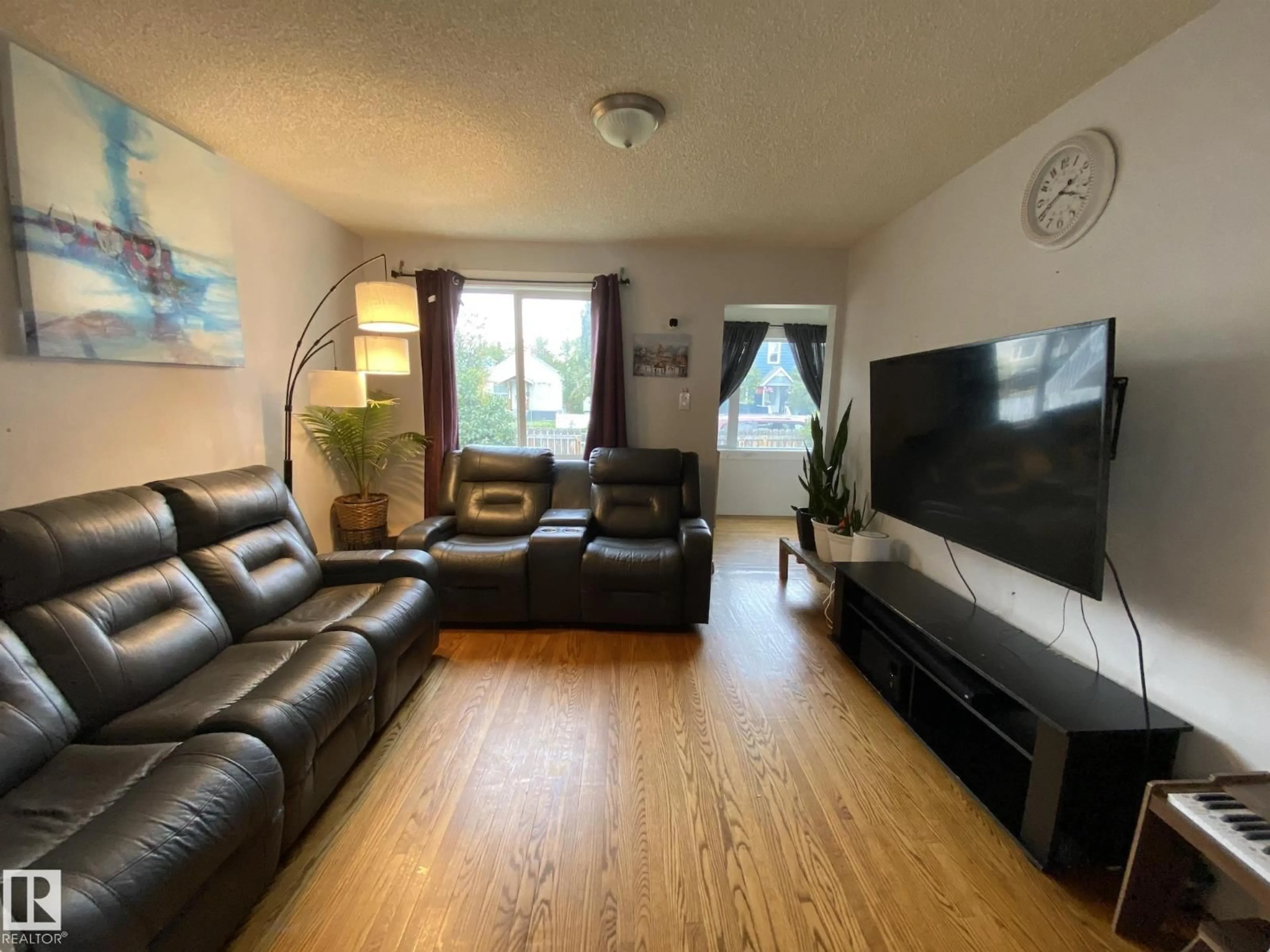 Living room with furniture, unknown for 11447 95 ST, Edmonton Alberta T5G1L3