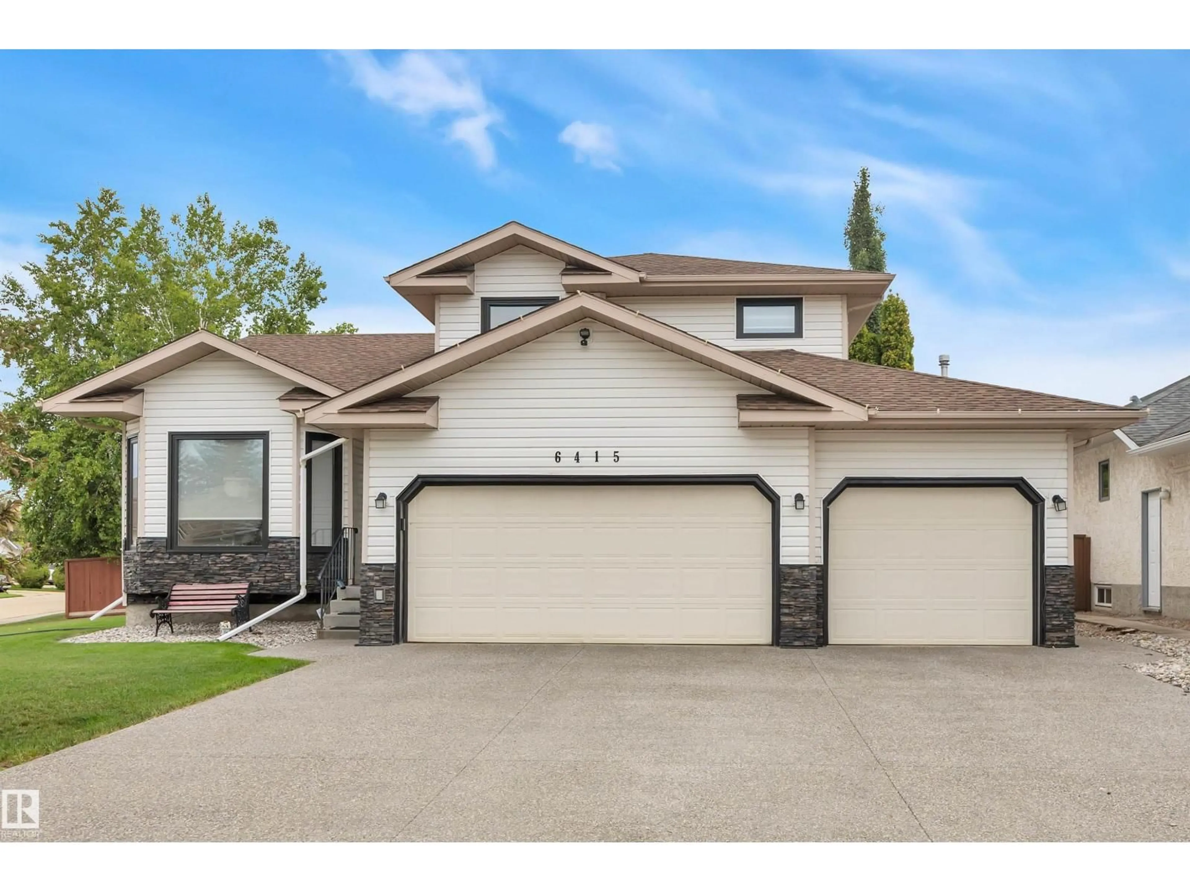 Home with vinyl exterior material, street for 6415 159 AV, Edmonton Alberta T5Y2P2