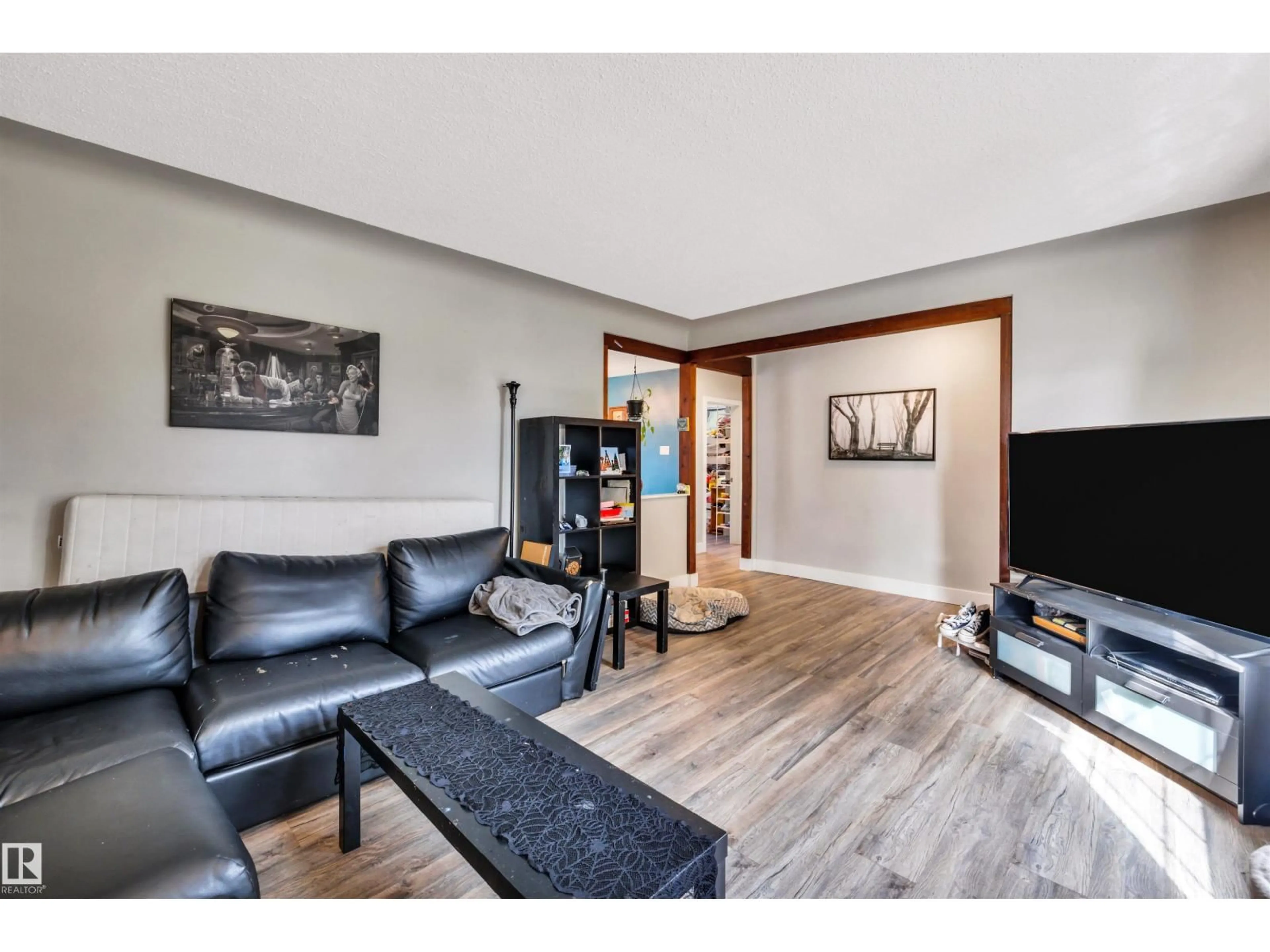Living room with furniture, wood/laminate floor for 9628 63 AV, Edmonton Alberta T6E0G5