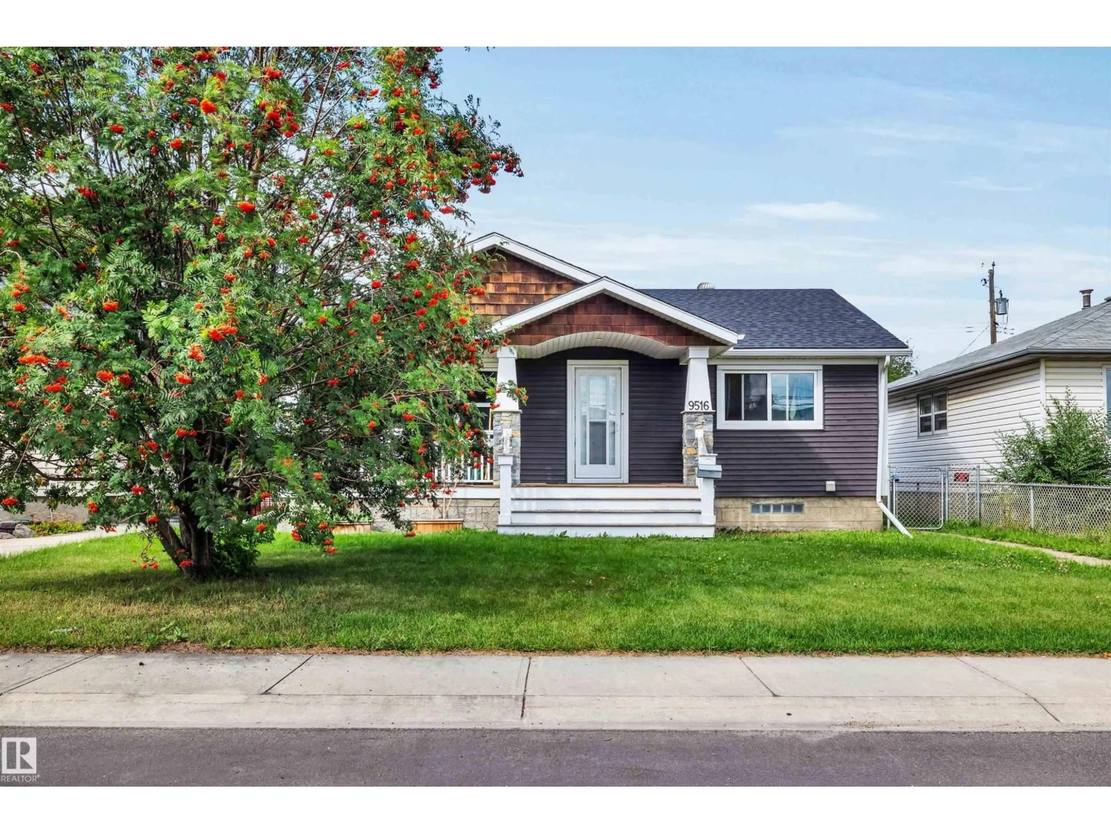 Home with vinyl exterior material, street for 9516 63 AV, Edmonton Alberta T6E0G4