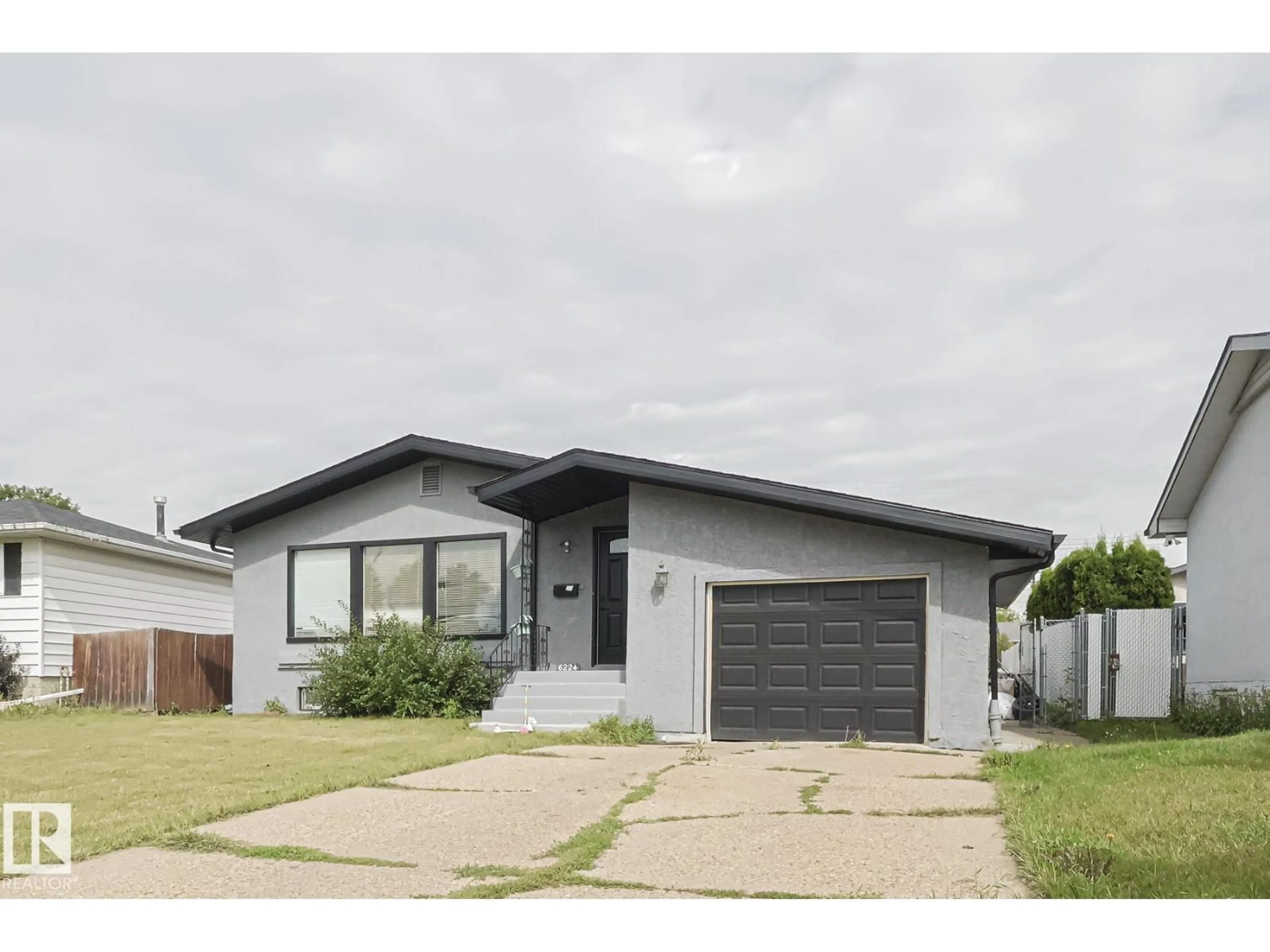 Home with vinyl exterior material, street for 6224 136 AV, Edmonton Alberta T5A0N6
