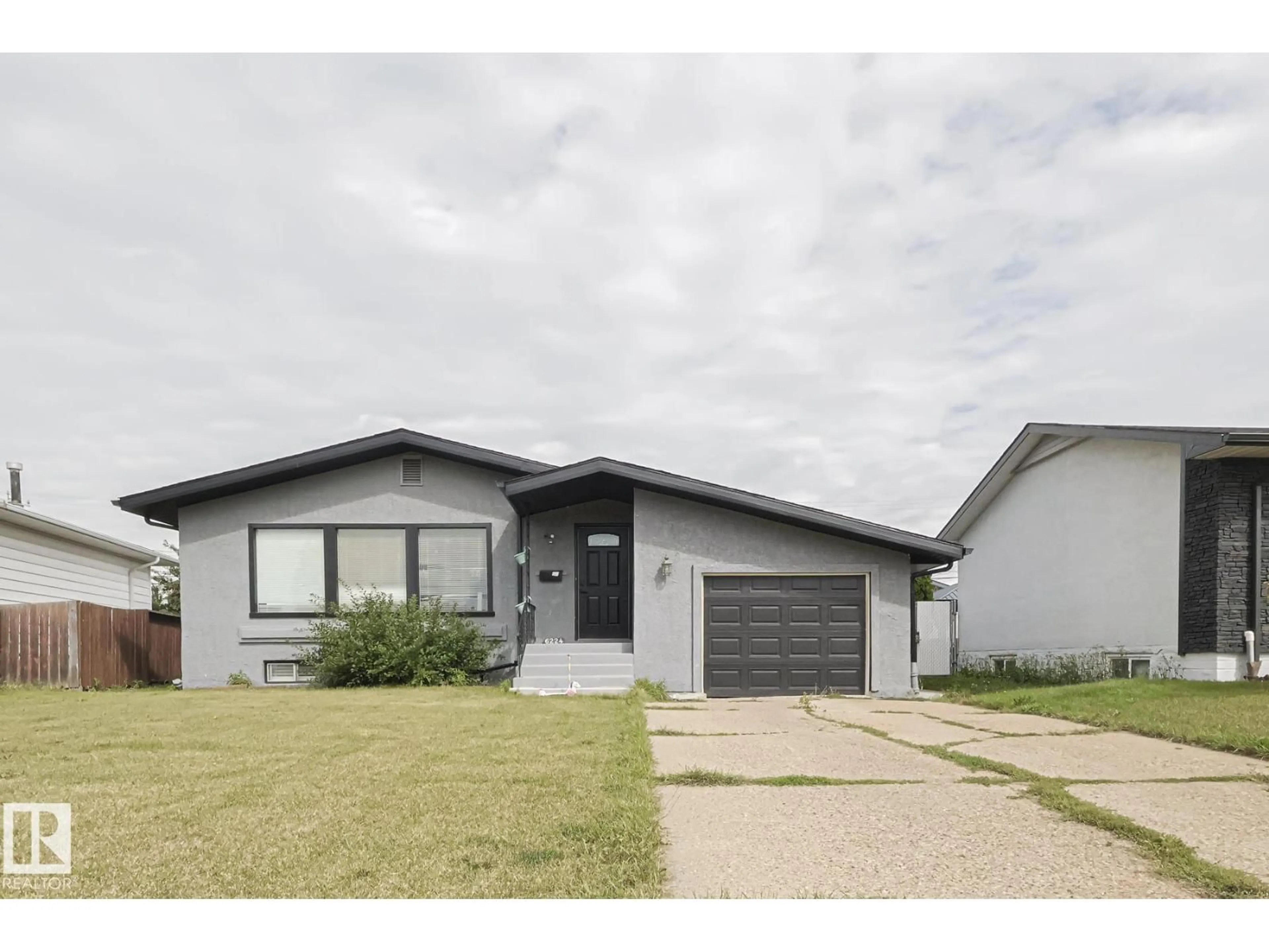 Home with vinyl exterior material, street for 6224 136 AV, Edmonton Alberta T5A0N6