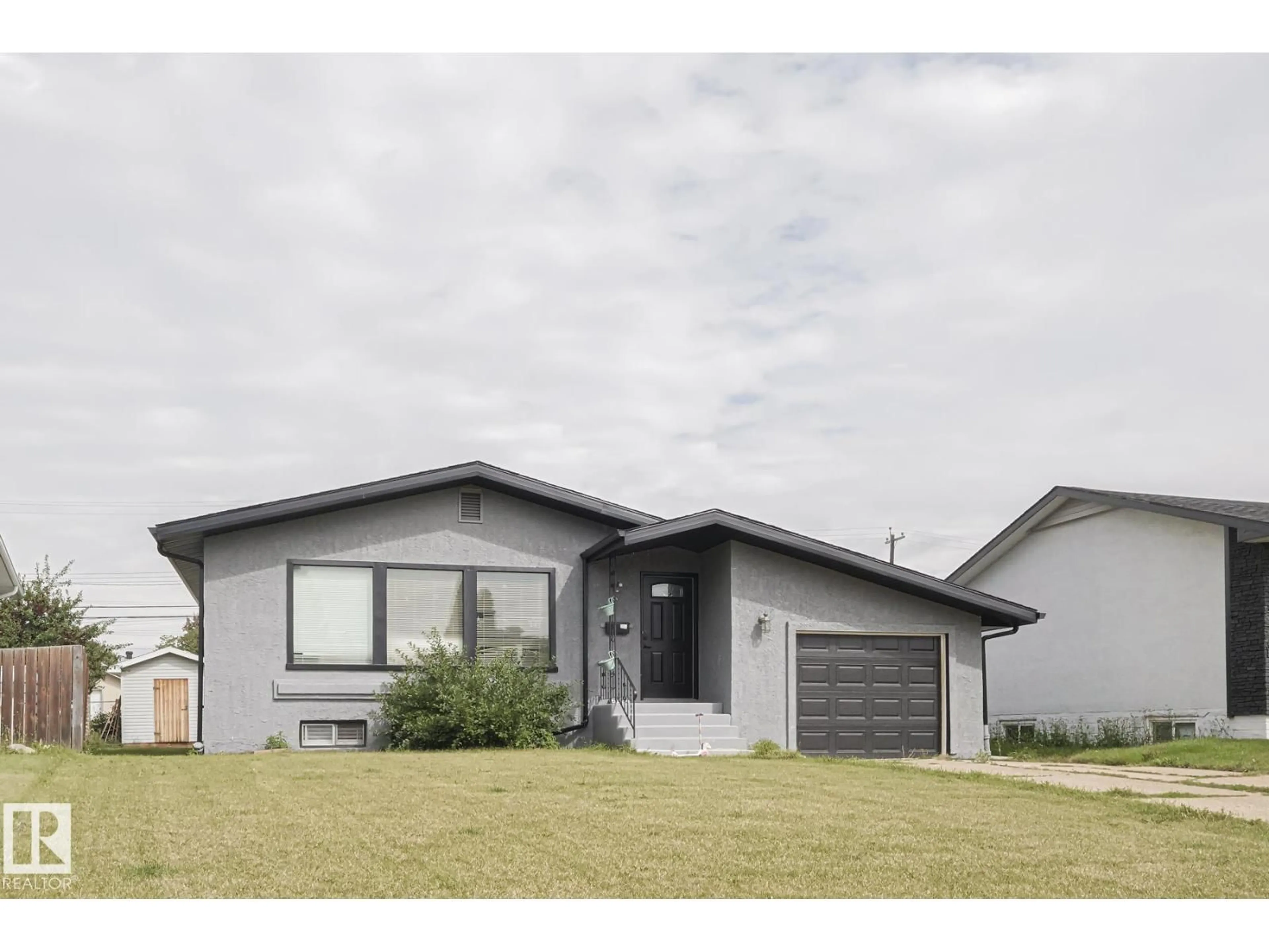 Home with vinyl exterior material, street for 6224 136 AV, Edmonton Alberta T5A0N6