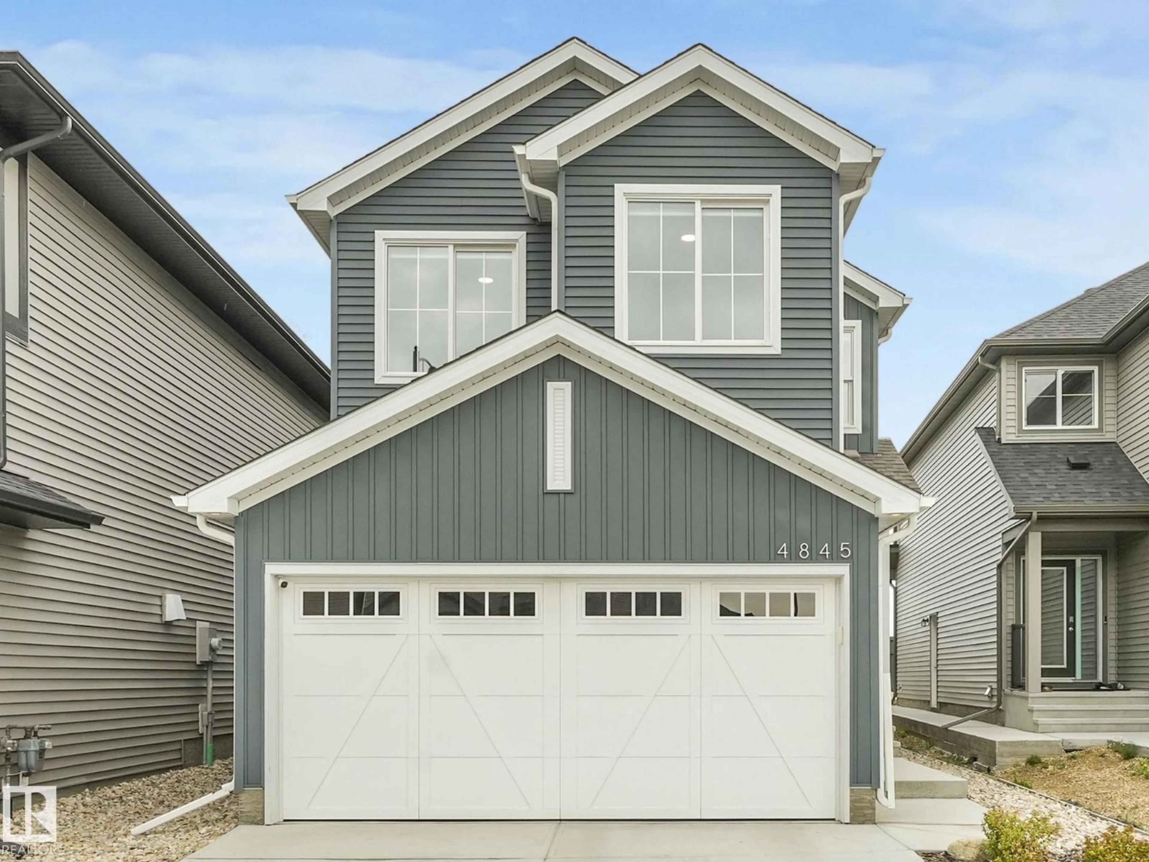 Home with vinyl exterior material, street for 4845 KINNEY RD, Edmonton Alberta T6W5G3