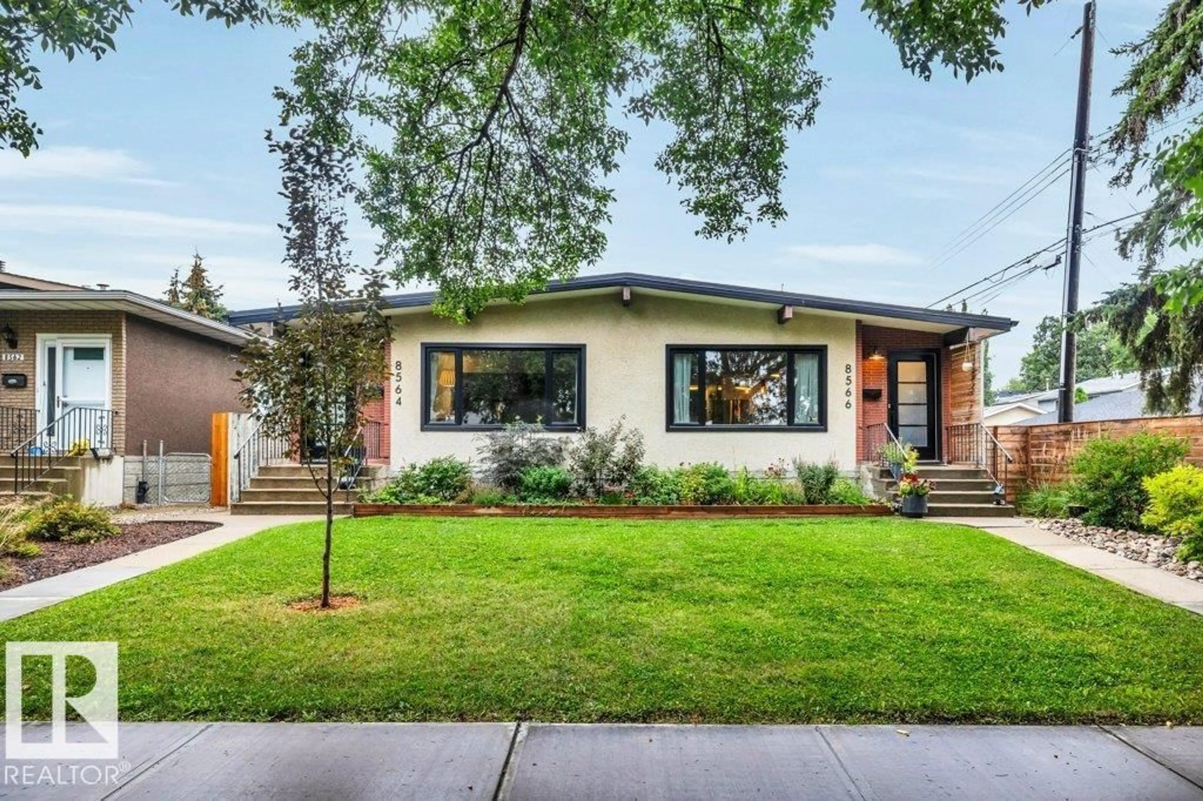 Home with brick exterior material, street for NW - 8564 & 8566 88 ST, Edmonton Alberta T6C3J5