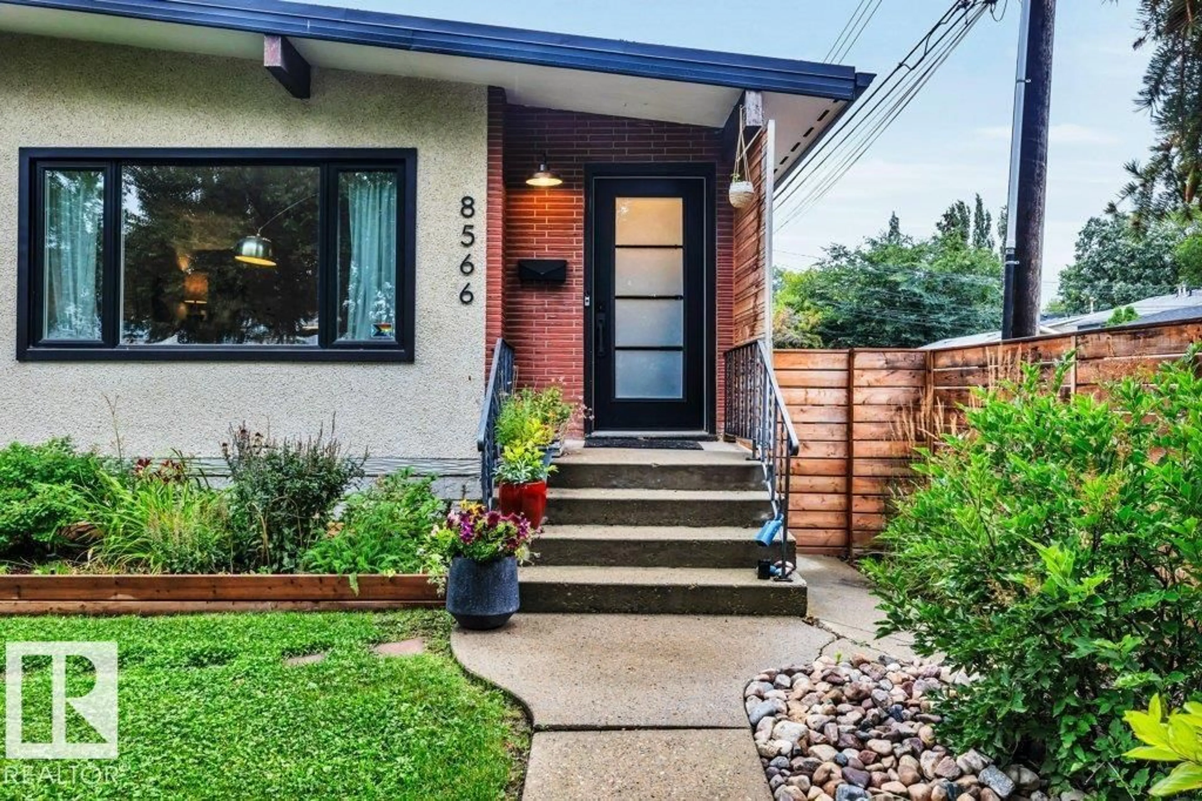 Home with brick exterior material, street for NW - 8564 & 8566 88 ST, Edmonton Alberta T6C3J5