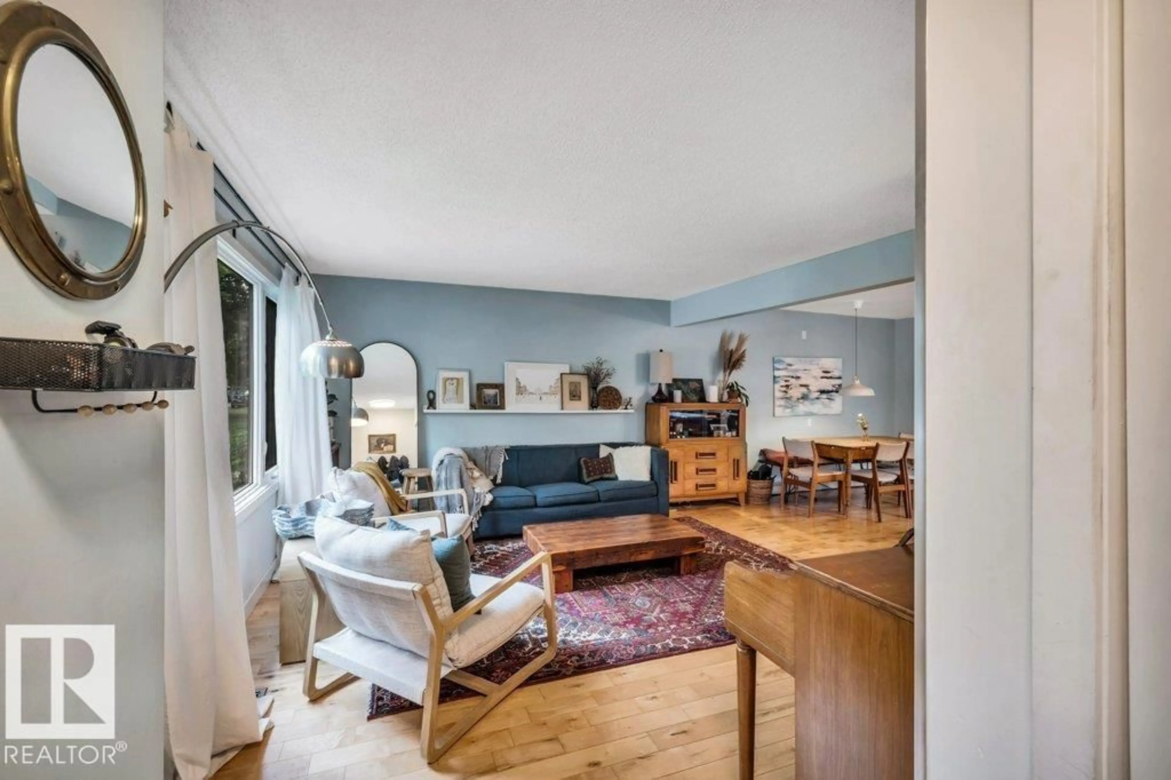 Living room with furniture, unknown for NW - 8564 & 8566 88 ST, Edmonton Alberta T6C3J5