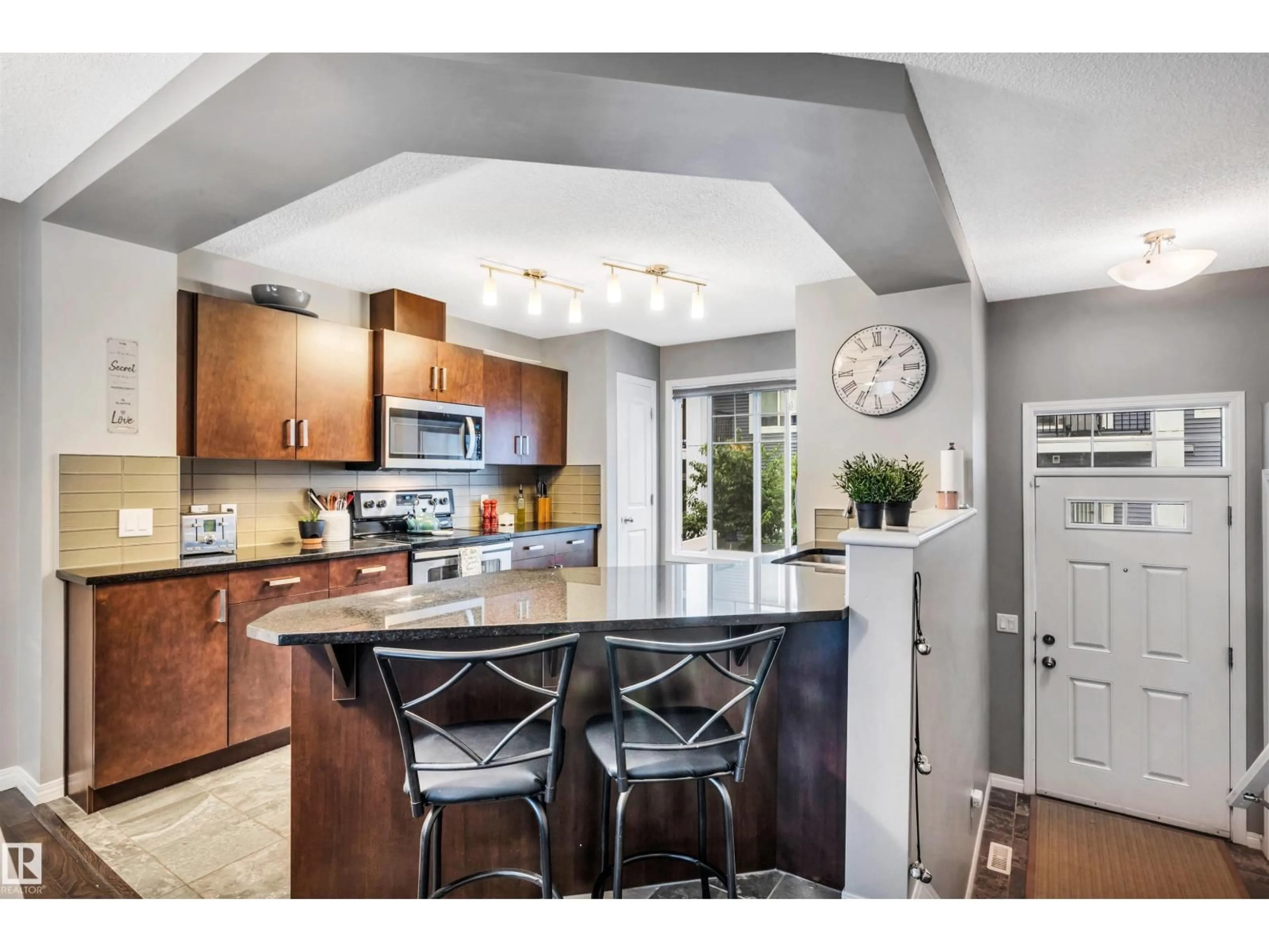 Open concept kitchen, ceramic/tile floor for 4050 - 19 SAVARYN DR, Edmonton Alberta T6X1R8