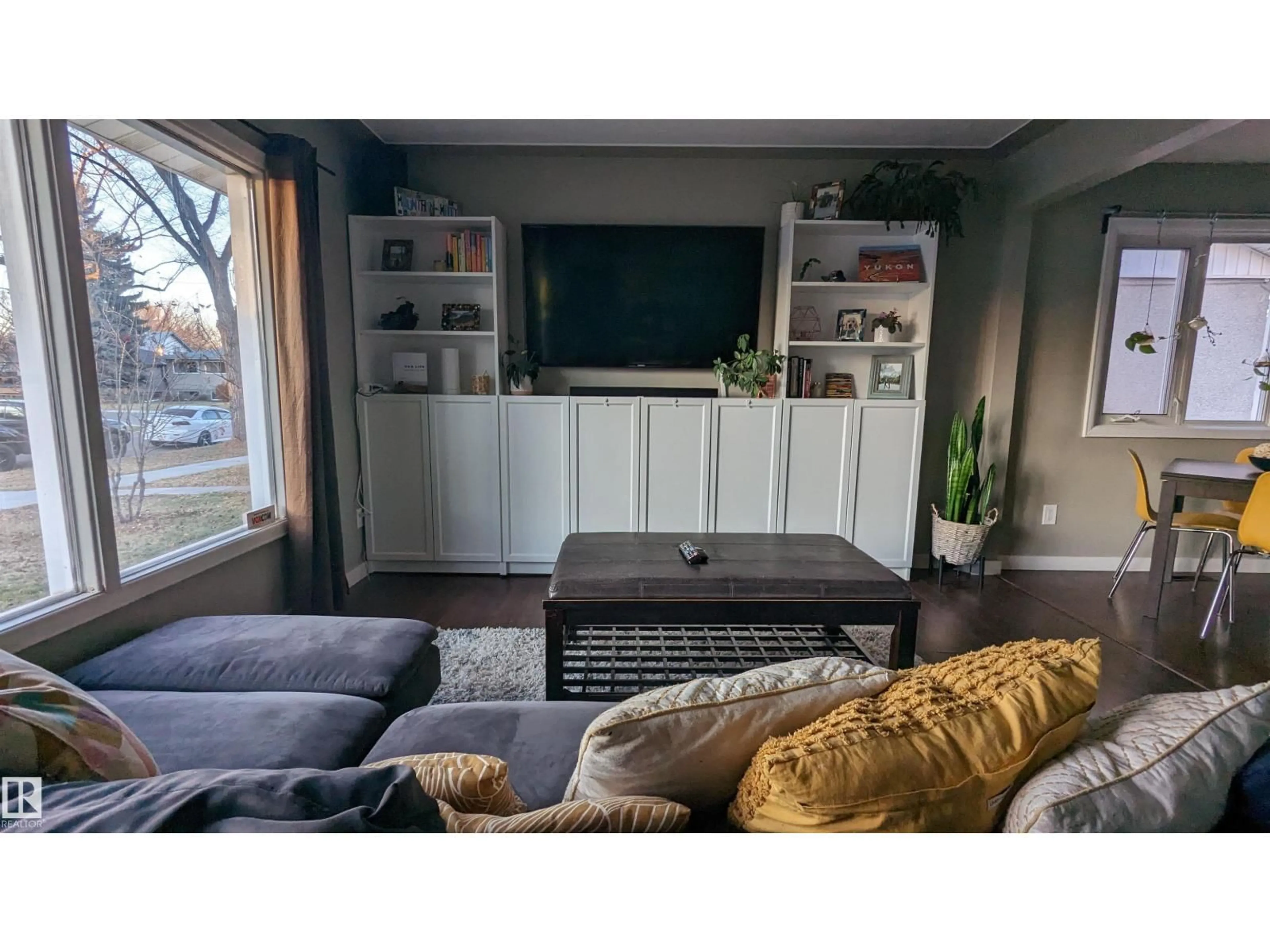 Living room with furniture, wood/laminate floor for NW - 6519 104A ST, Edmonton Alberta T6H2M2