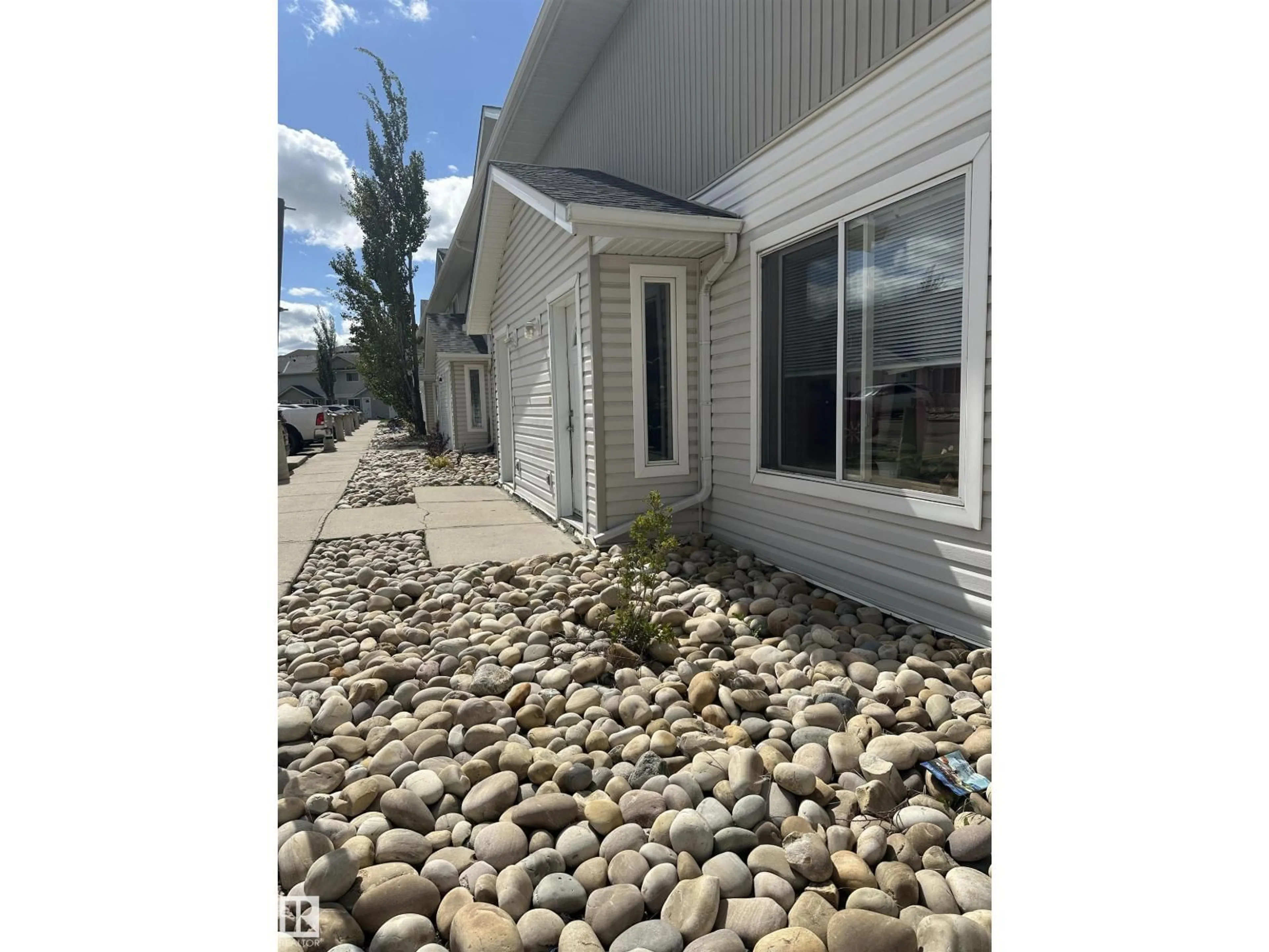 Home with vinyl exterior material, street for 180 - 137 BRIDGEPORT BV, Leduc Alberta T9E8S1