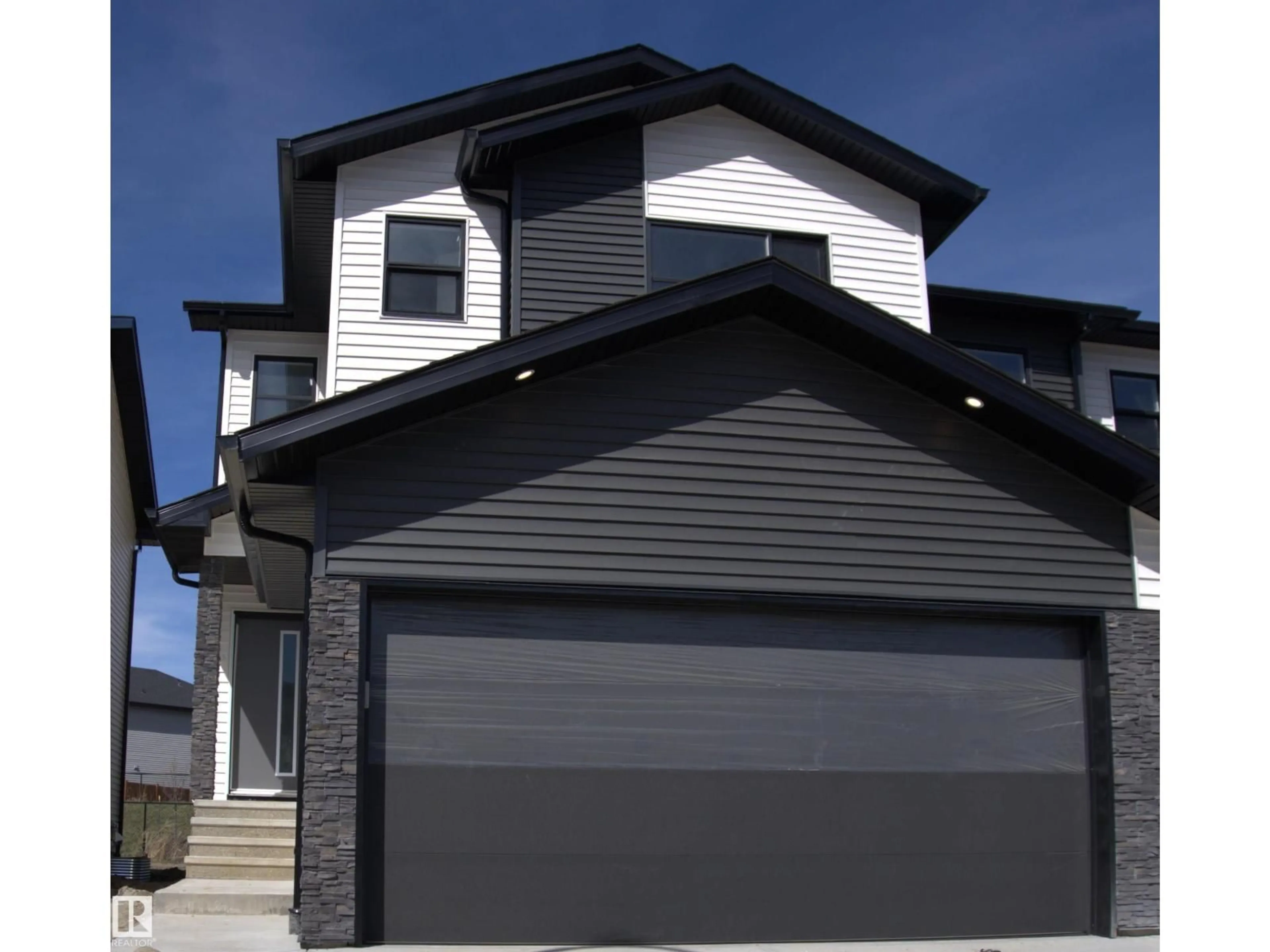Home with vinyl exterior material, street for 7722 174A AV, Edmonton Alberta T5Z0W5