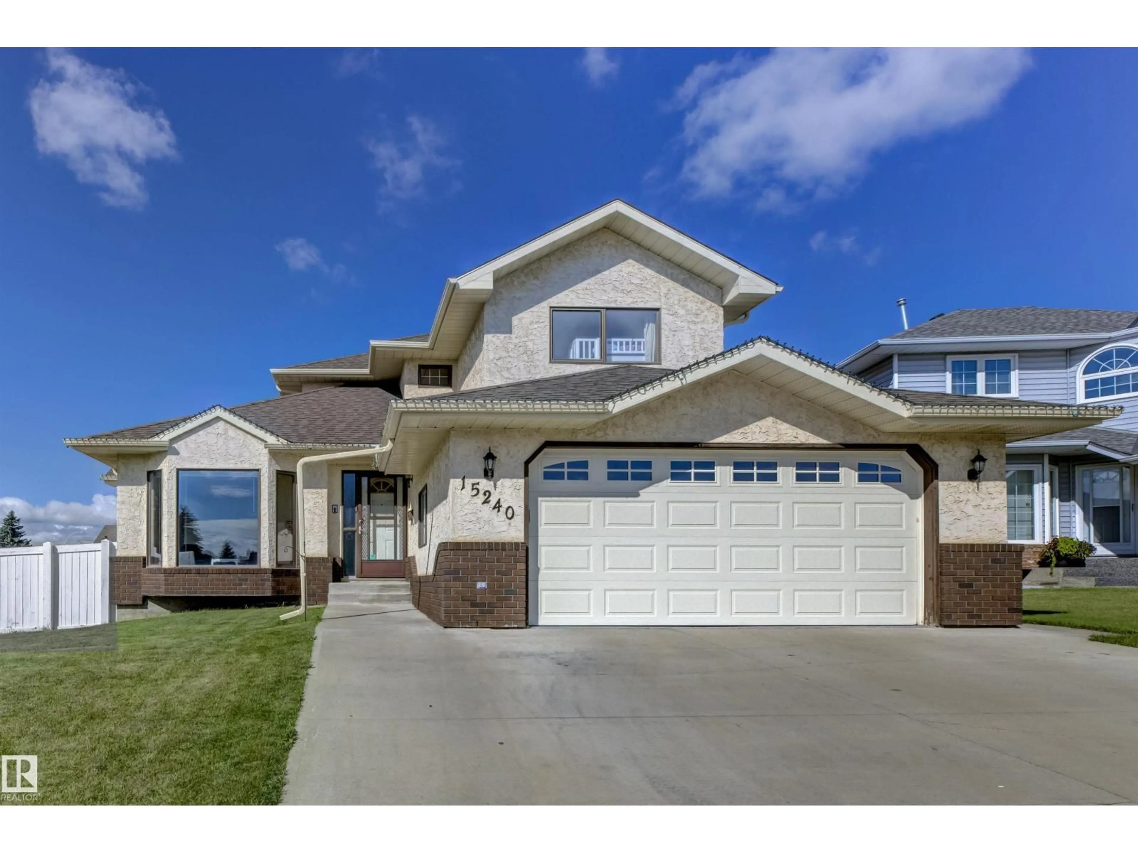 Home with vinyl exterior material, street for NW - 15240 59A ST, Edmonton Alberta T5A4X5