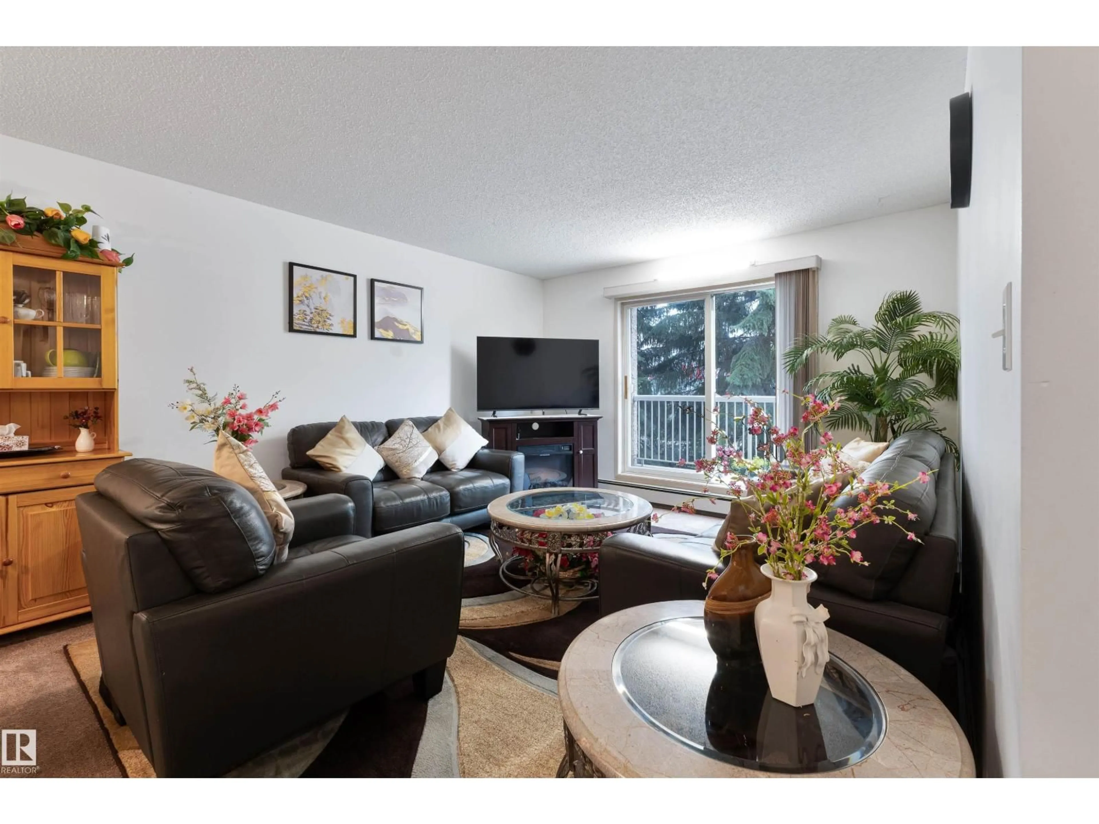 Living room with furniture, wood/laminate floor for #204 - 4220 139 AV, Edmonton Alberta T5Y2Y2