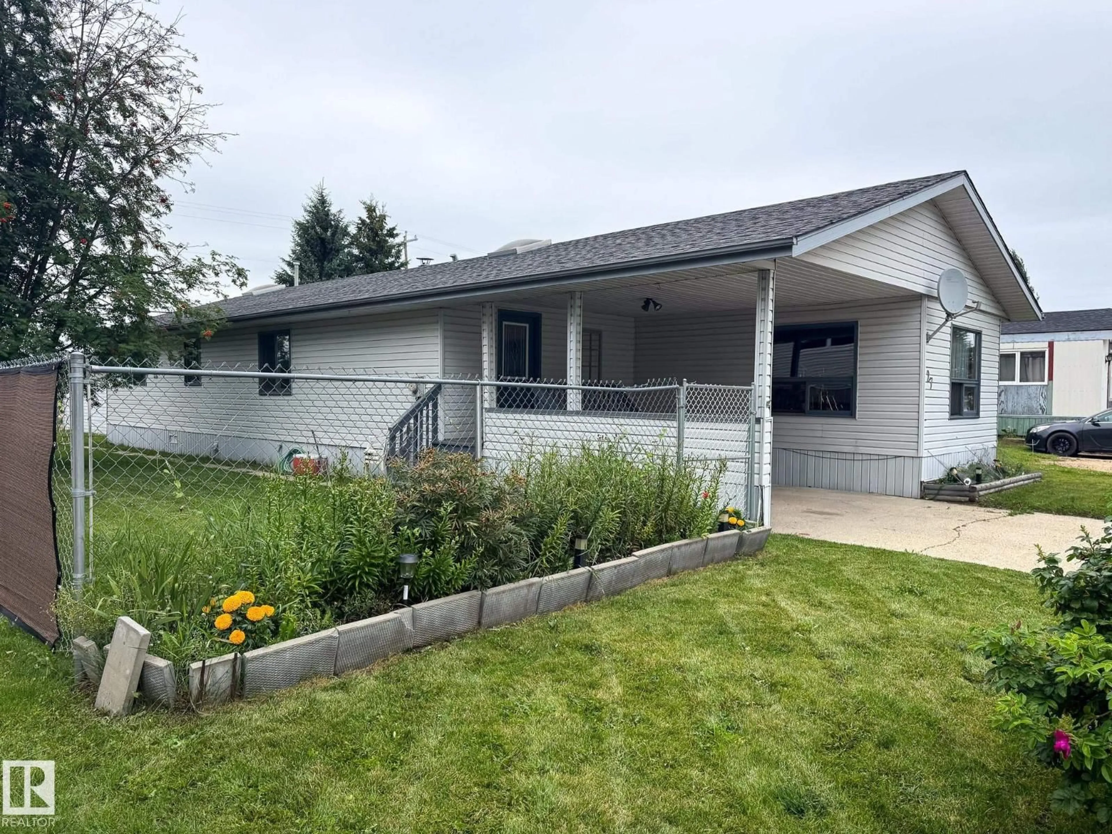 Home with vinyl exterior material, street for 27 AUTTREAUX DR, Whitecourt Alberta T7S1C8