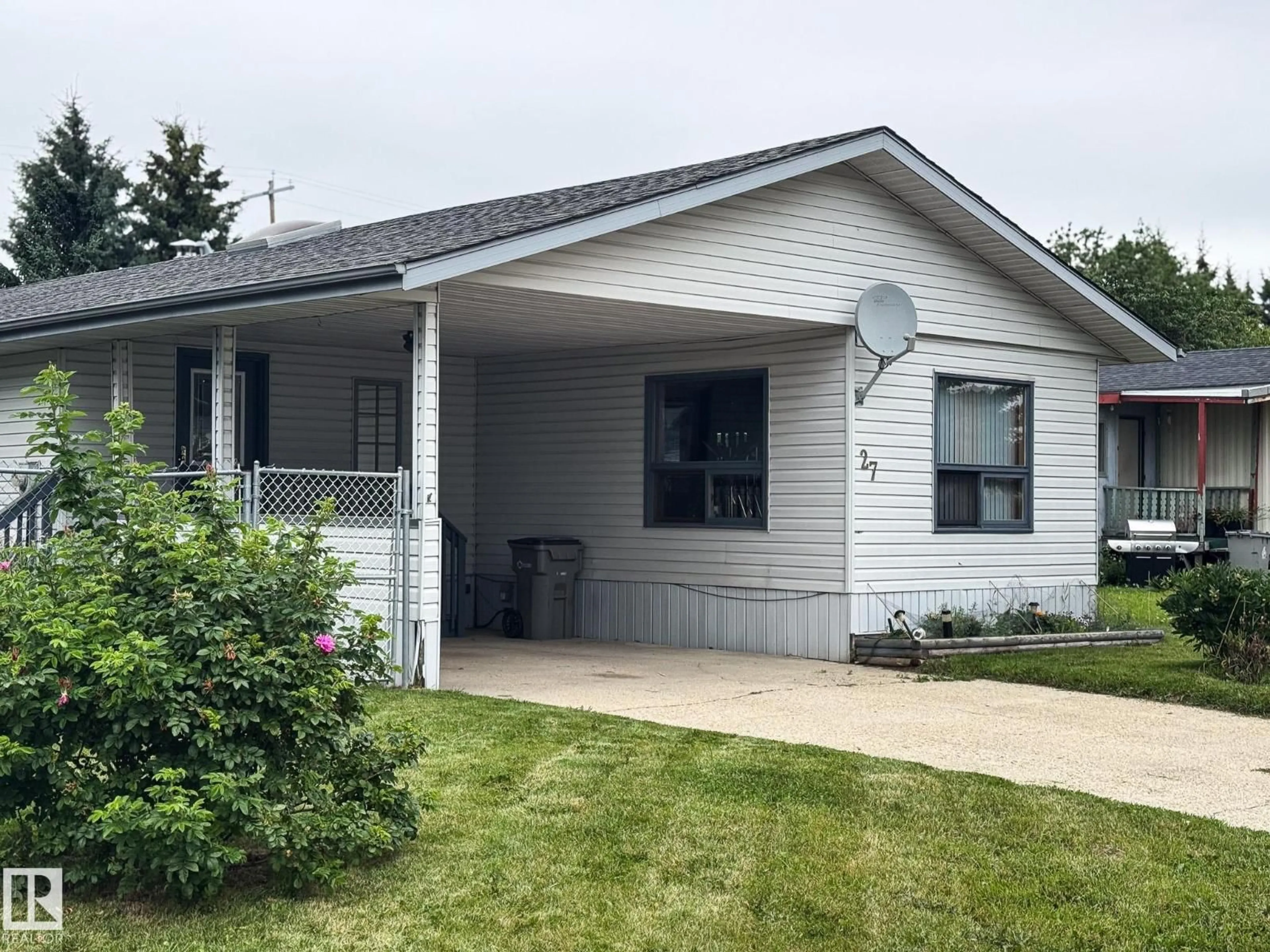 Home with vinyl exterior material, street for 27 AUTTREAUX DR, Whitecourt Alberta T7S1C8