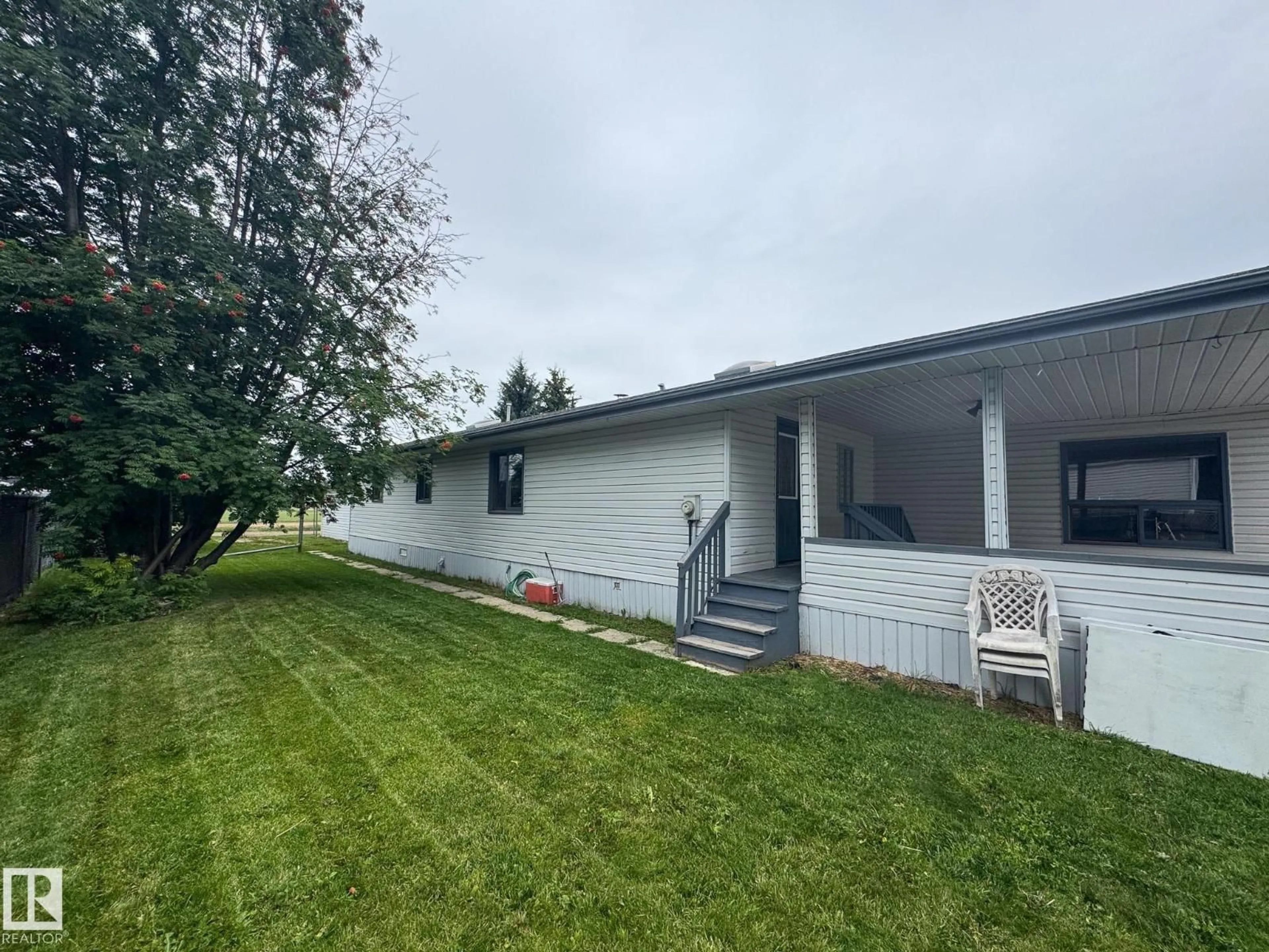 A pic from outside/outdoor area/front of a property/back of a property/a pic from drone, unknown for 27 AUTTREAUX DR, Whitecourt Alberta T7S1C8