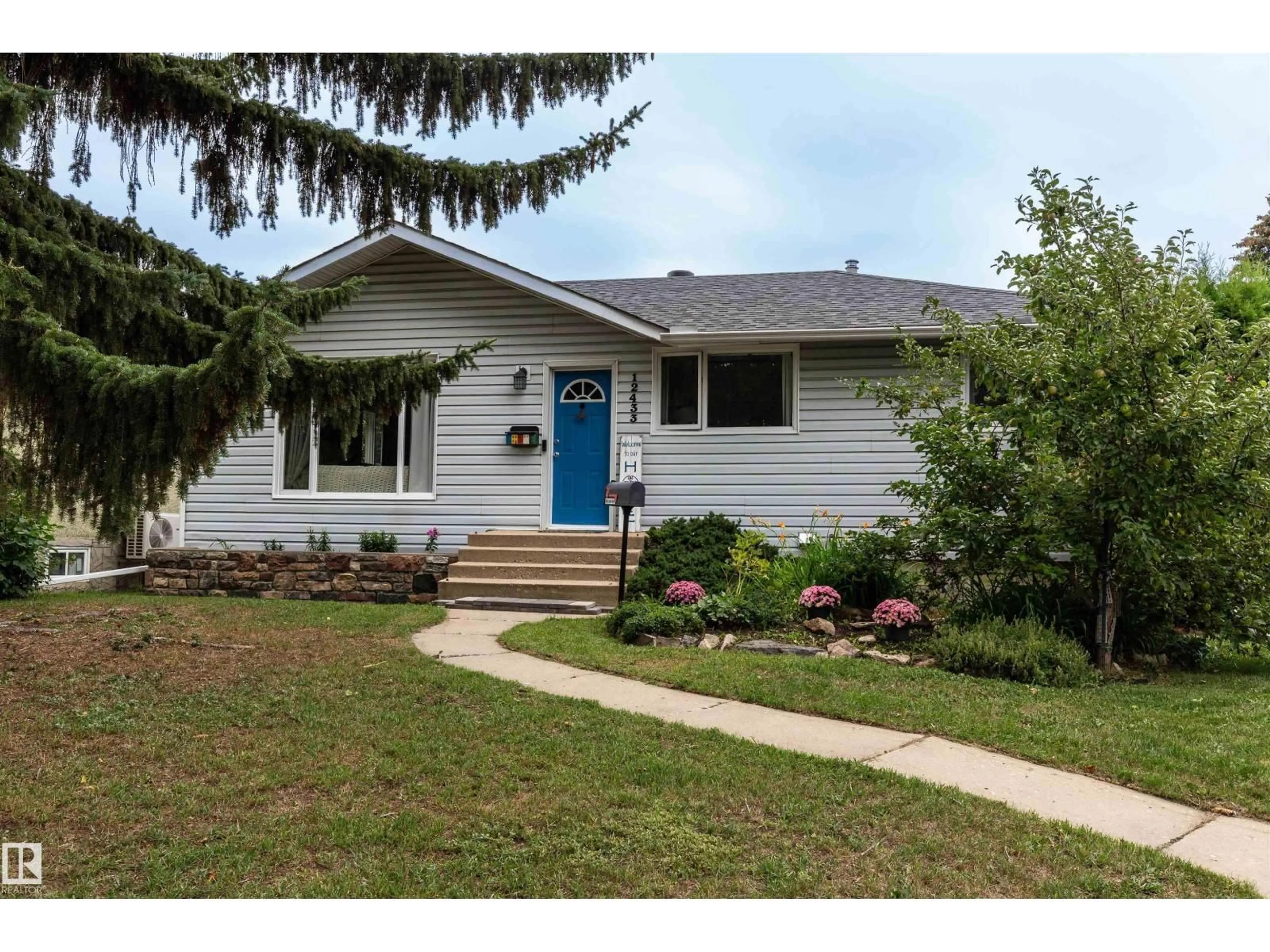 Home with vinyl exterior material, street for 12433 134 ST NW, Edmonton Alberta T5L1V3