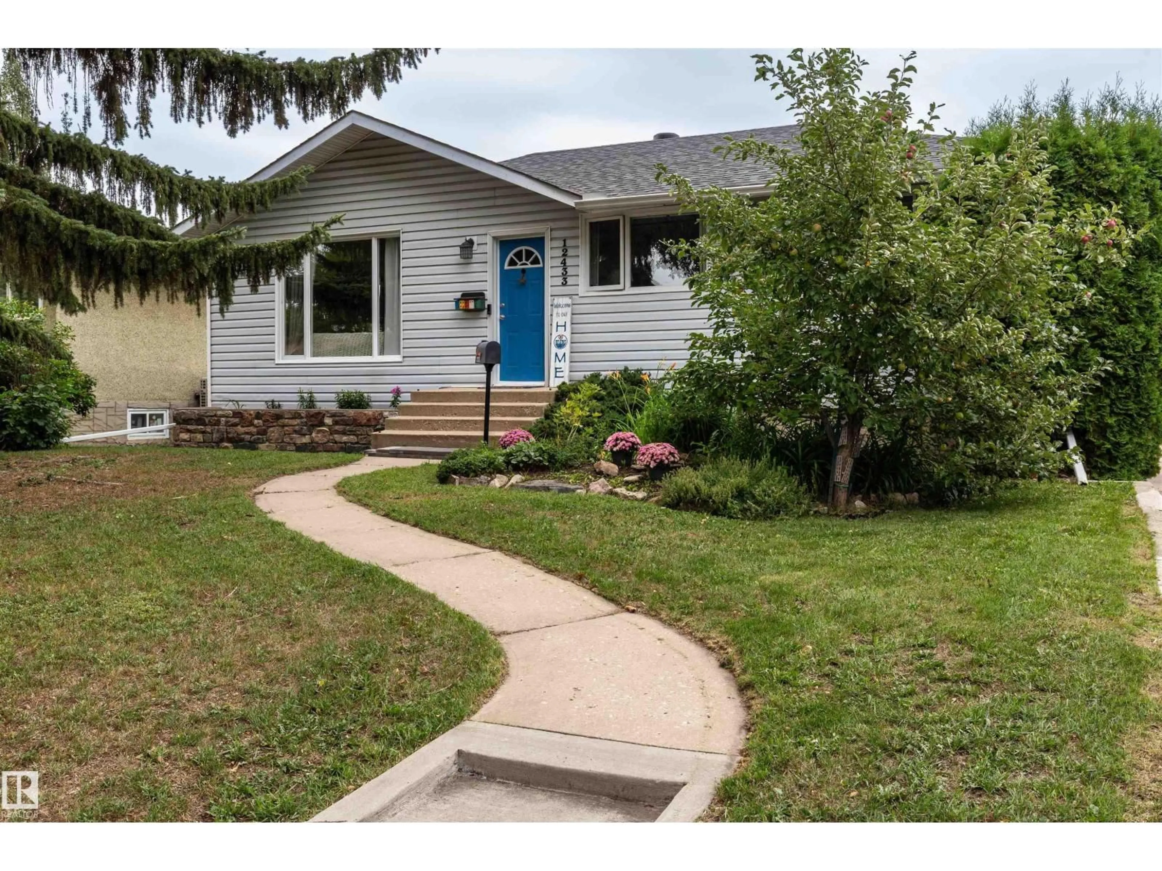 Home with vinyl exterior material, street for 12433 134 ST NW, Edmonton Alberta T5L1V3