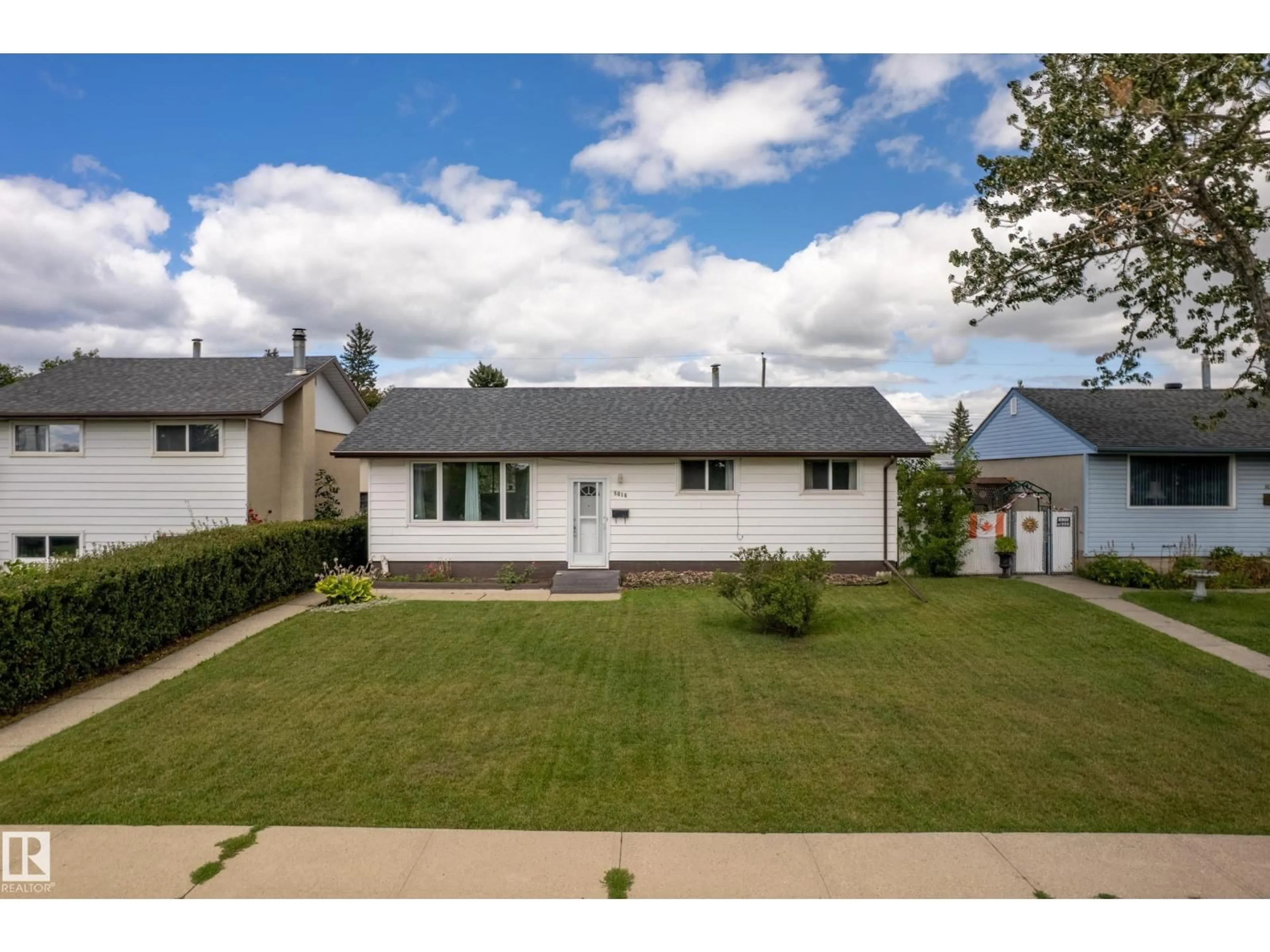 Home with vinyl exterior material, street for 8016 131A AV, Edmonton Alberta T5C2A3