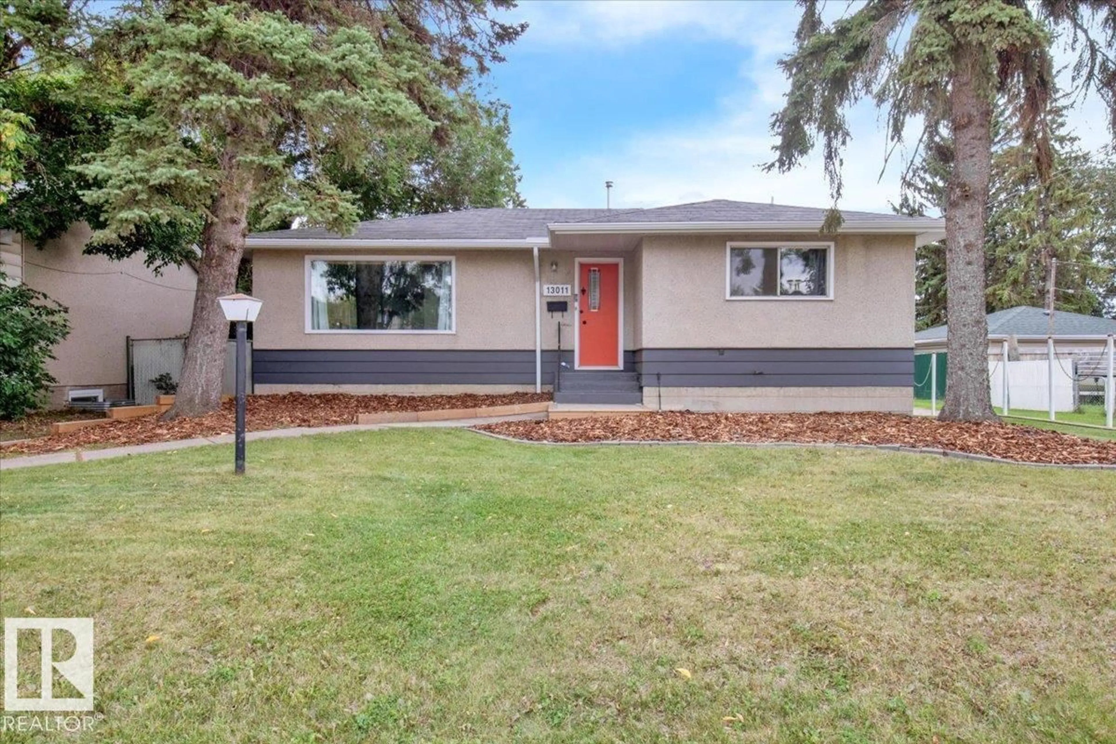 Home with vinyl exterior material, street for NW - 13011 137 AV, Edmonton Alberta T5L4C3