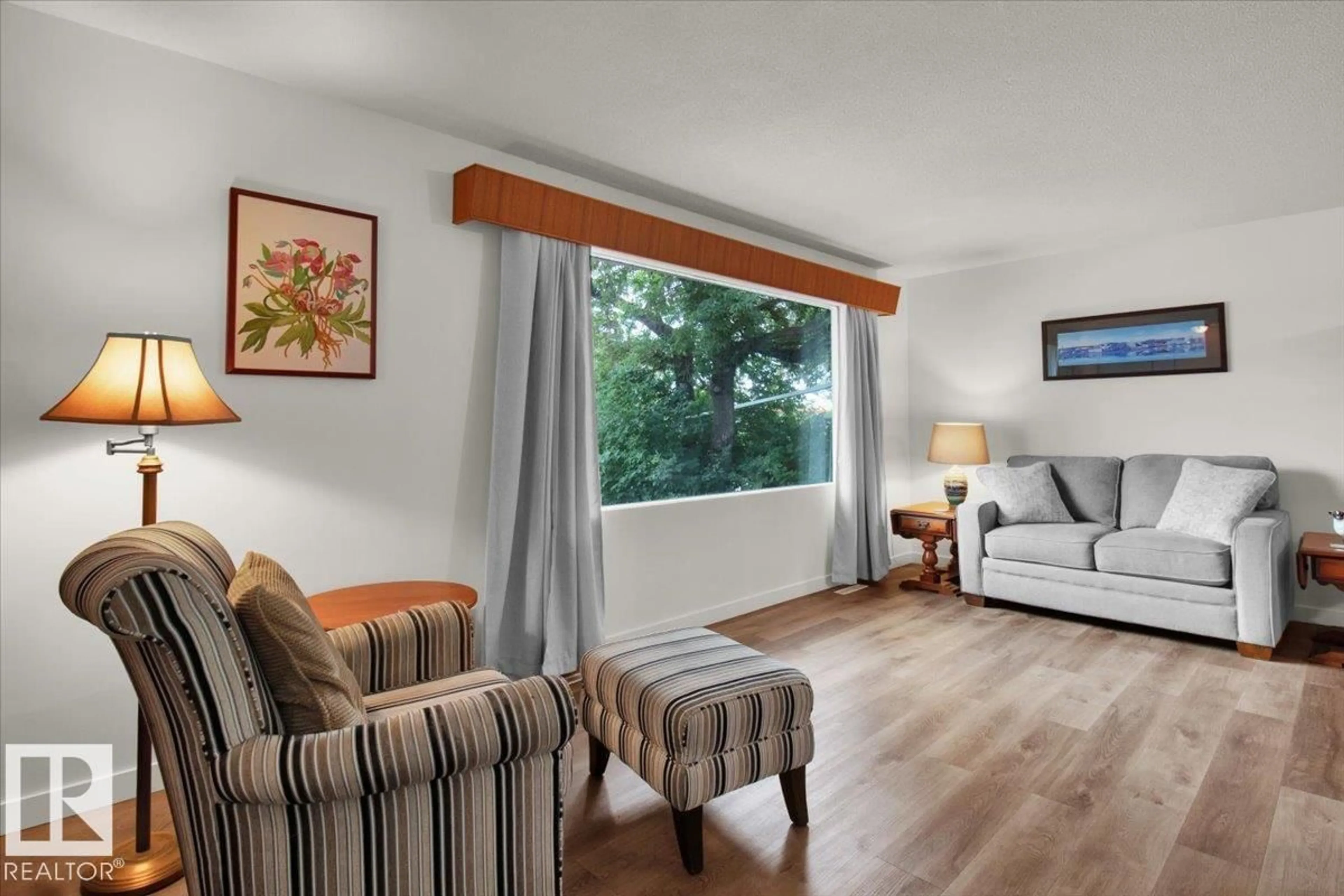 Living room with furniture, wood/laminate floor for NW - 13011 137 AV, Edmonton Alberta T5L4C3
