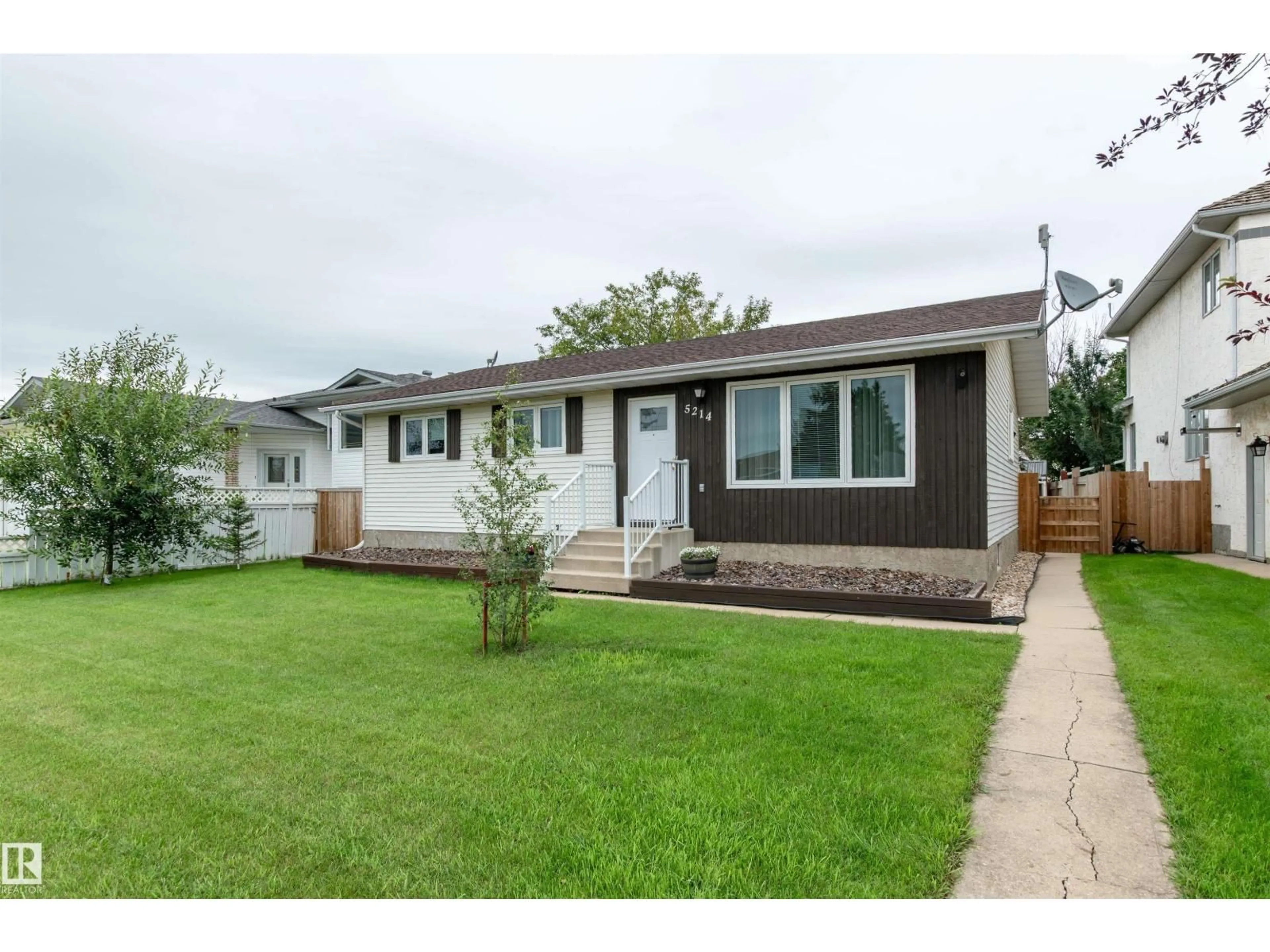 Home with vinyl exterior material, street for 5214 45 ST, Tofield Alberta T0B0S0