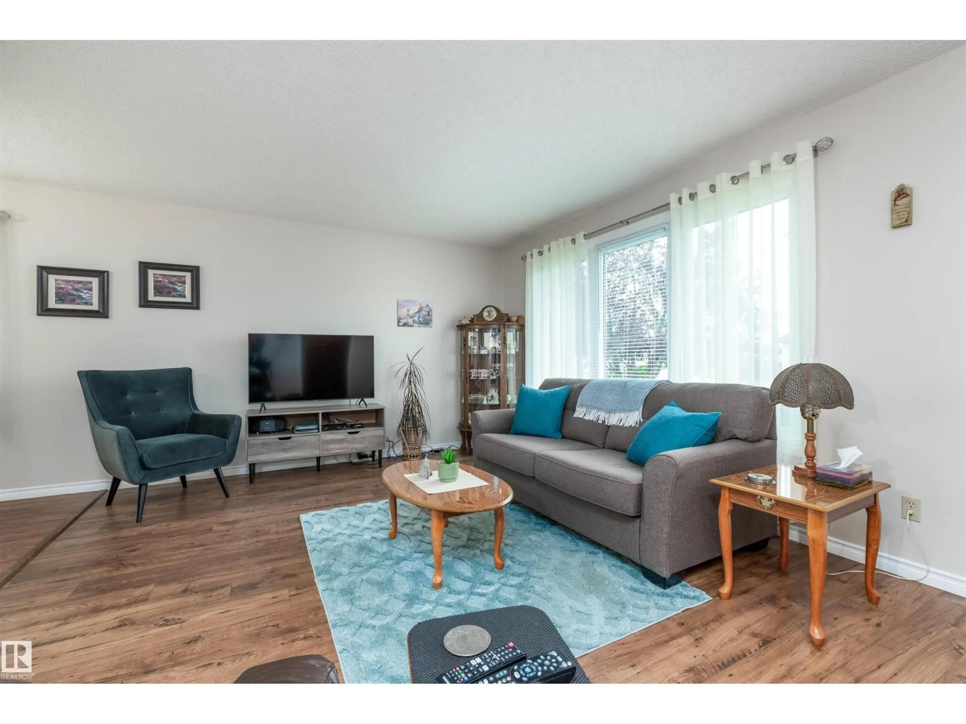 Living room with furniture, wood/laminate floor for 5214 45 ST, Tofield Alberta T0B0S0