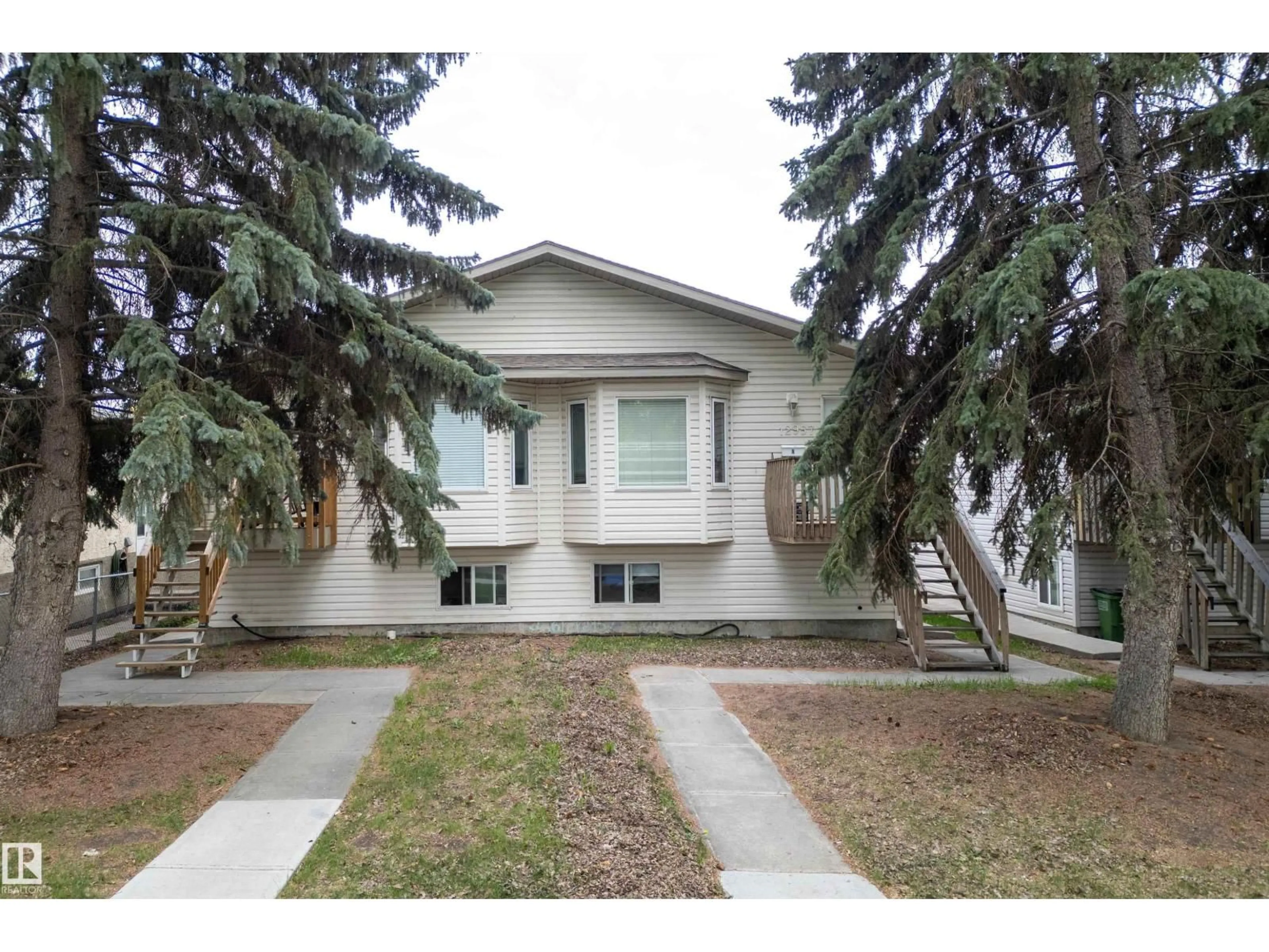 Home with vinyl exterior material, street for NW - 12957 - 12959 117 ST, Edmonton Alberta T5E5J8