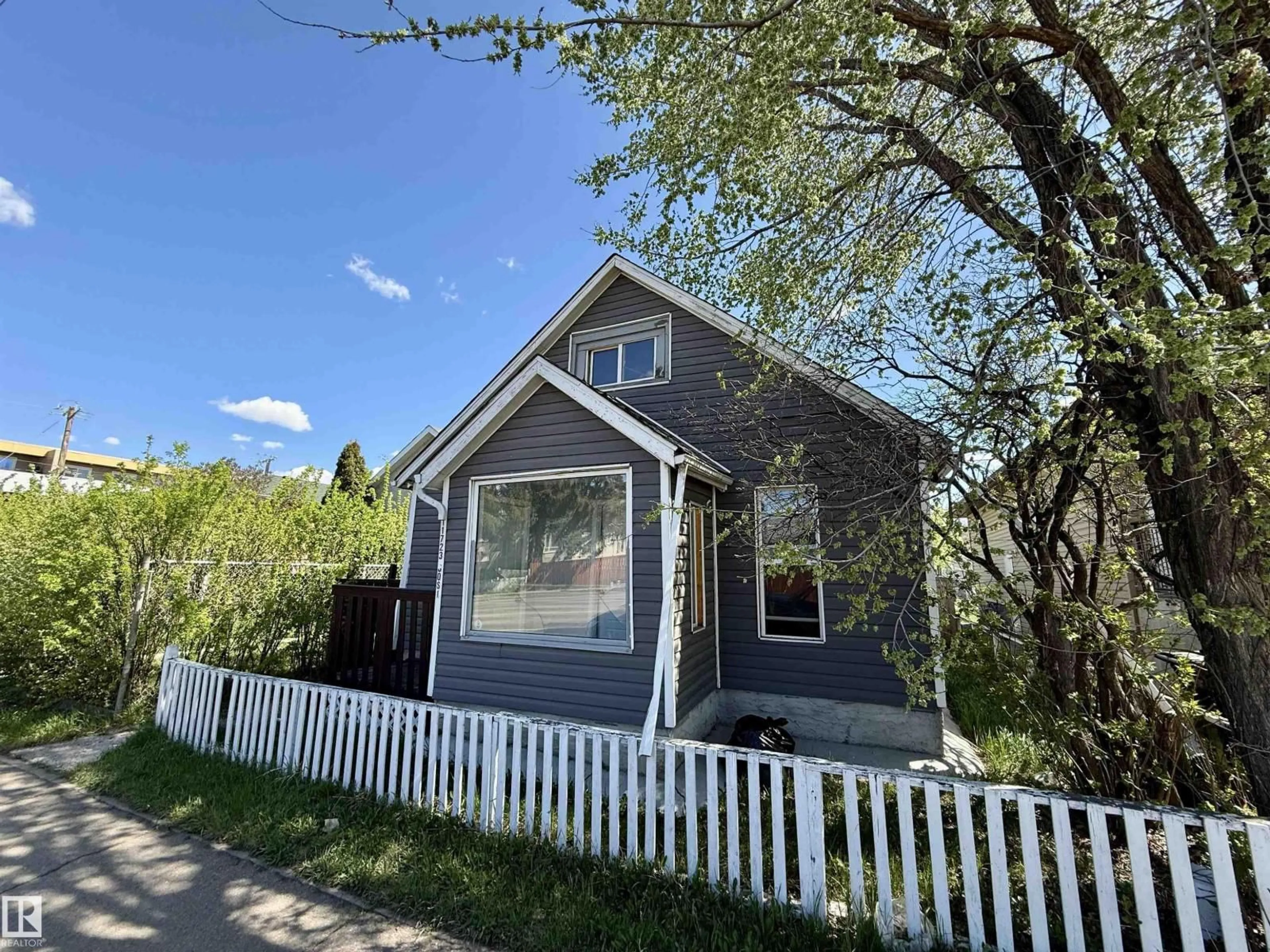 Home with vinyl exterior material, street for 11723 80 ST, Edmonton Alberta T5B2N4