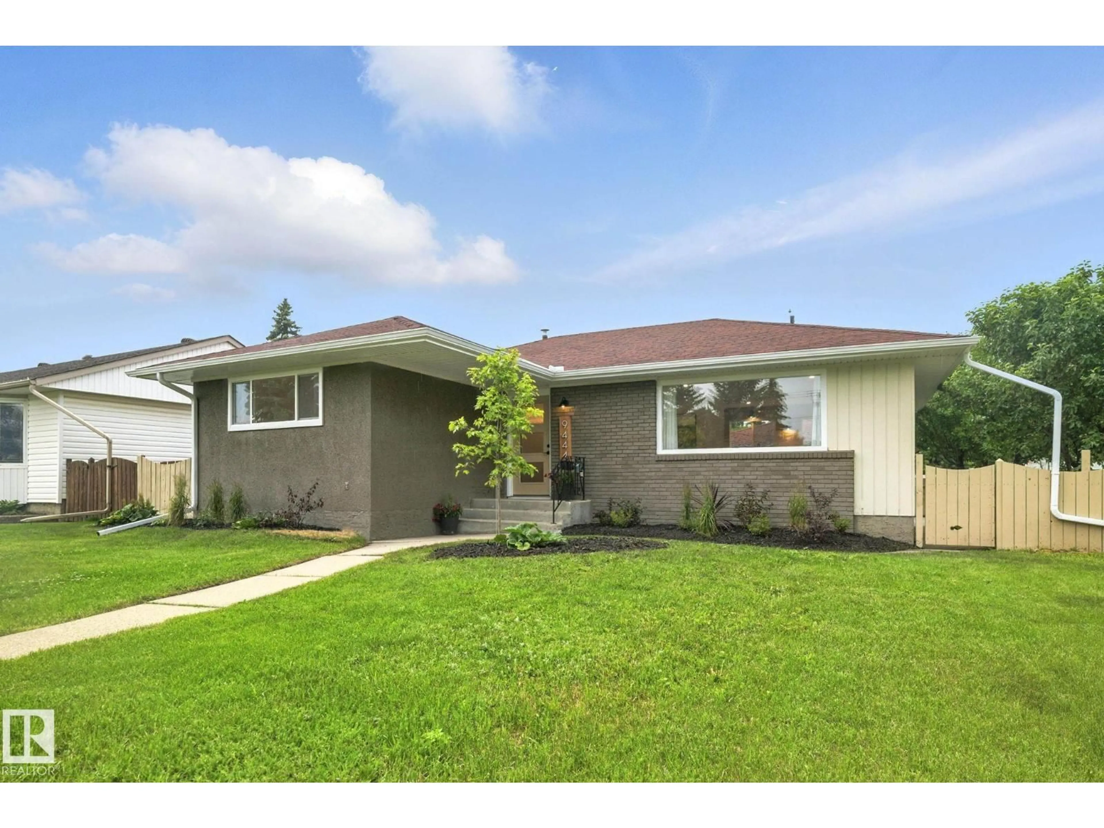 Home with vinyl exterior material, street for 9444 74 ST, Edmonton Alberta T6B2B4
