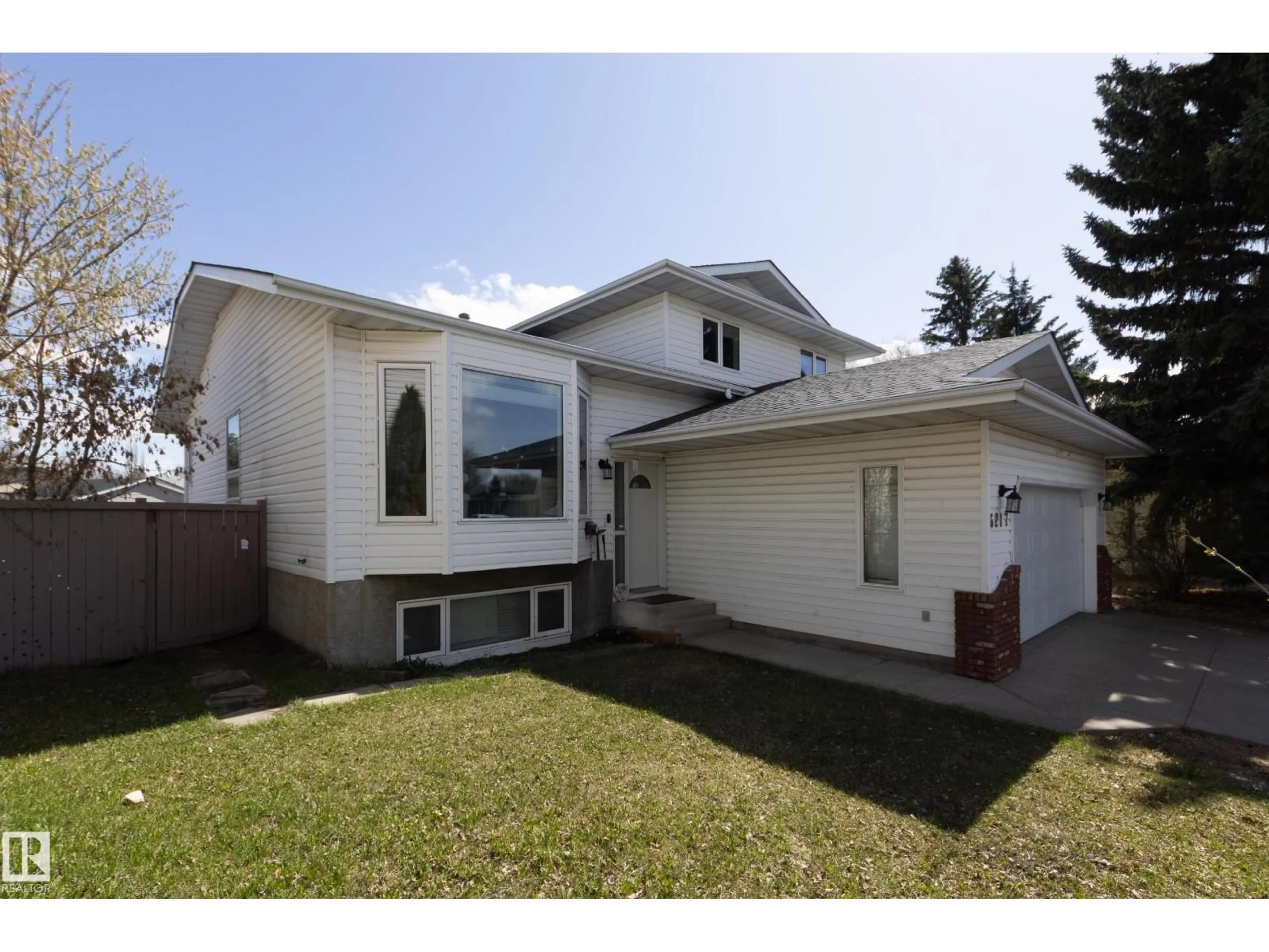 Home with vinyl exterior material, street for 6217 13 AV, Edmonton Alberta T6L2E5