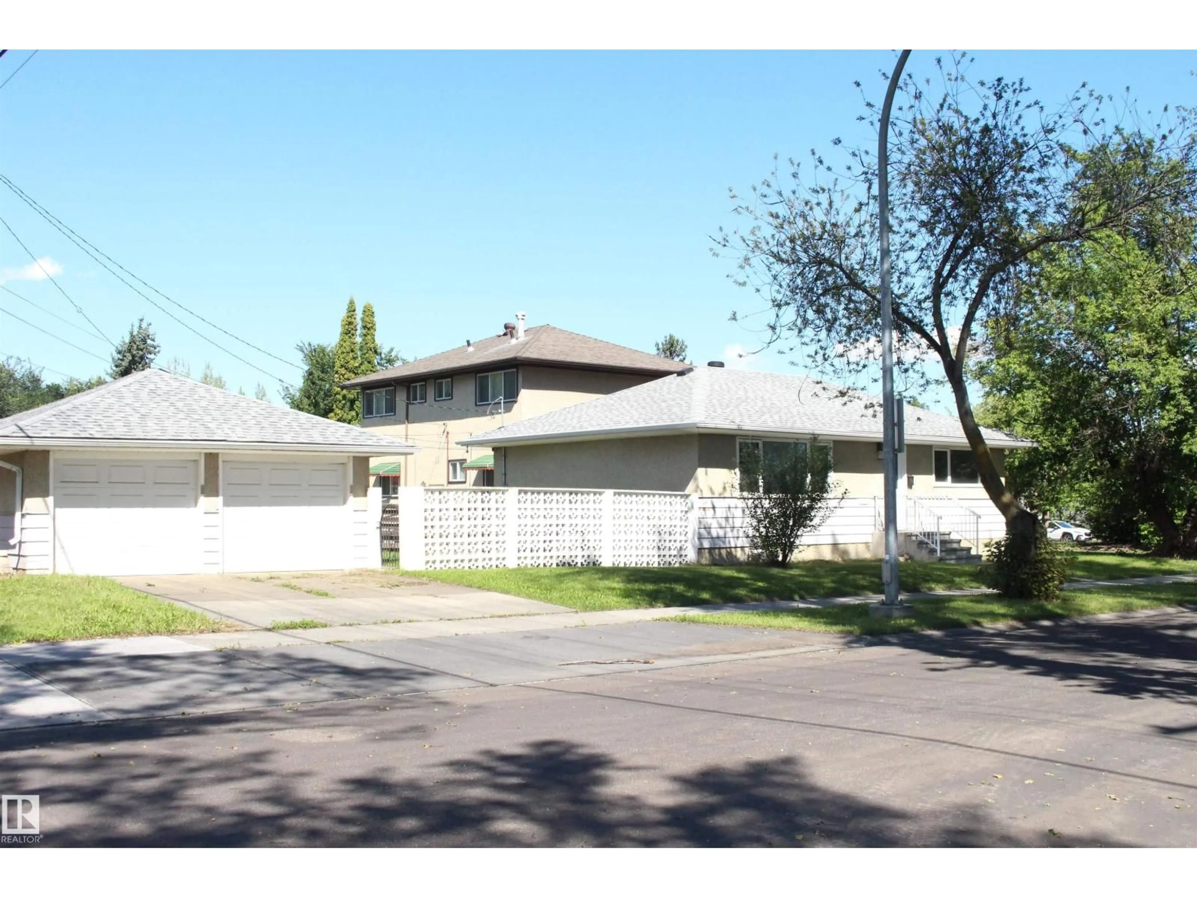 Home with vinyl exterior material, street for 7504 77 AV, Edmonton Alberta T6C0K5