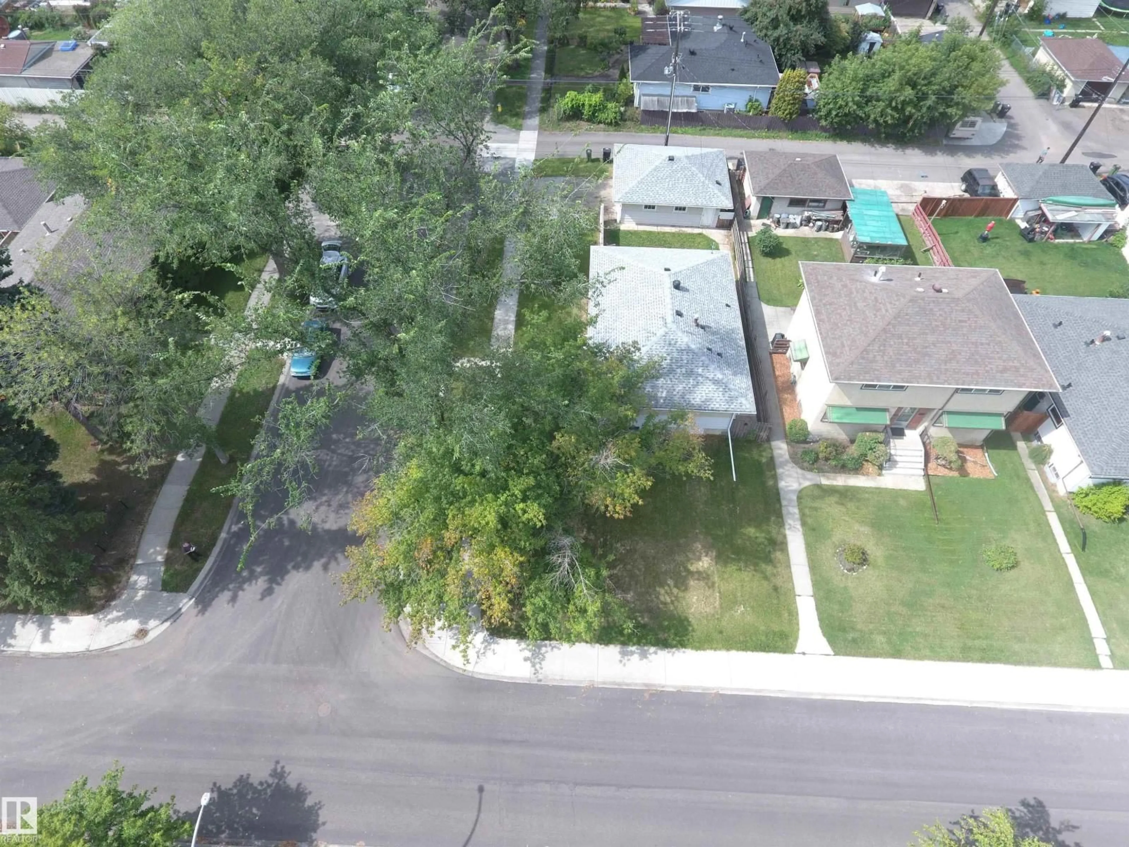 A pic from outside/outdoor area/front of a property/back of a property/a pic from drone, street for 7504 77 AV, Edmonton Alberta T6C0K5