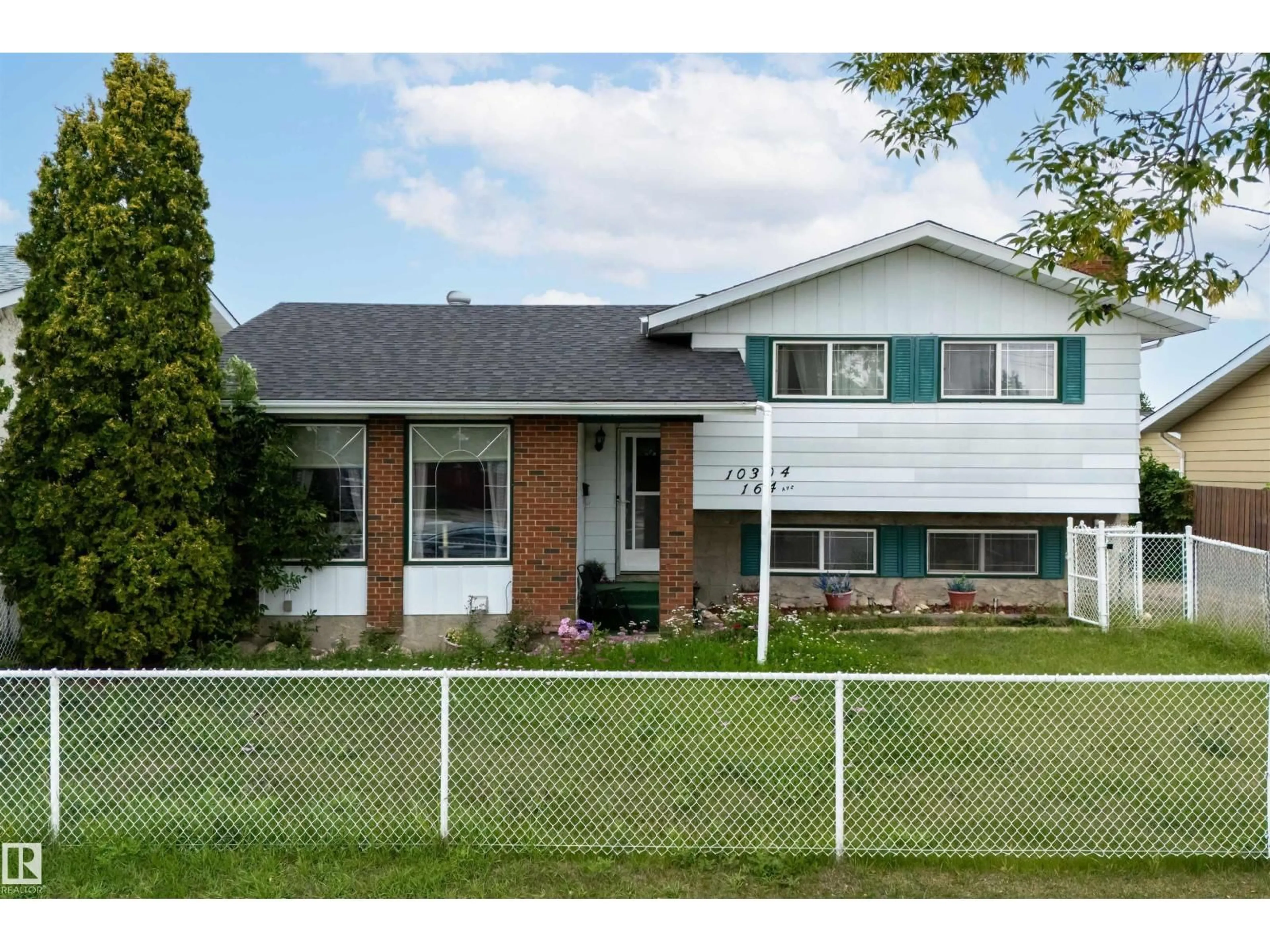 Home with brick exterior material, street for 10304 164 AV, Edmonton Alberta T5X2E2