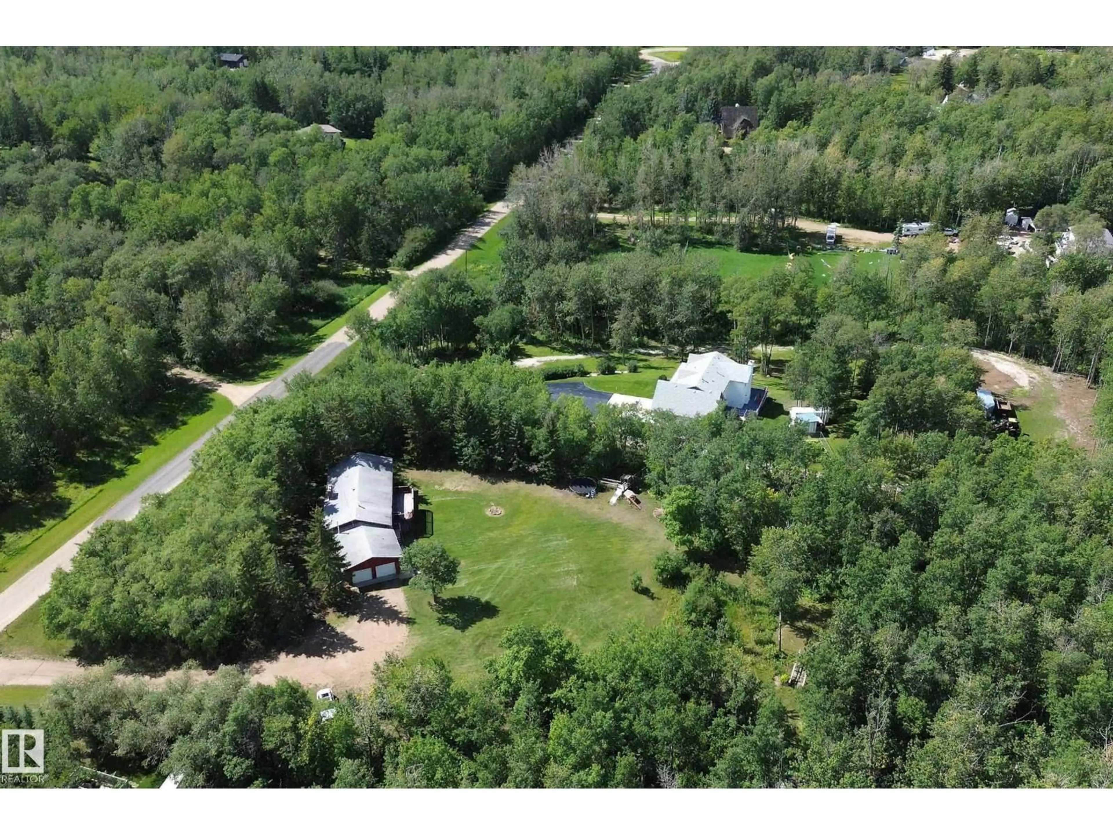 A pic from outside/outdoor area/front of a property/back of a property/a pic from drone, forest/trees view for 253 52152 RGE ROAD 225, Rural Strathcona County Alberta T8C1C6