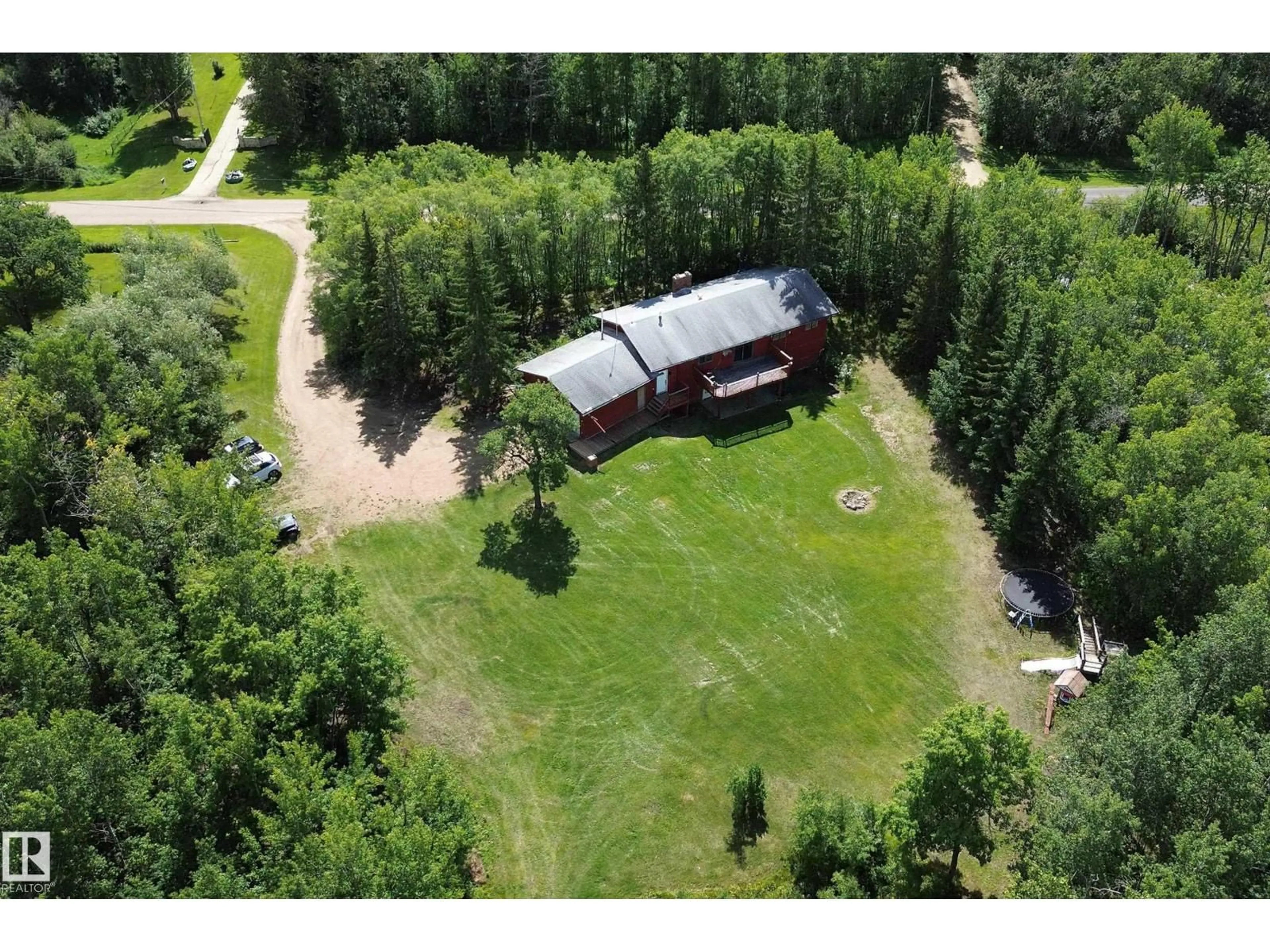 A pic from outside/outdoor area/front of a property/back of a property/a pic from drone, forest/trees view for 253 52152 RGE ROAD 225, Rural Strathcona County Alberta T8C1C6