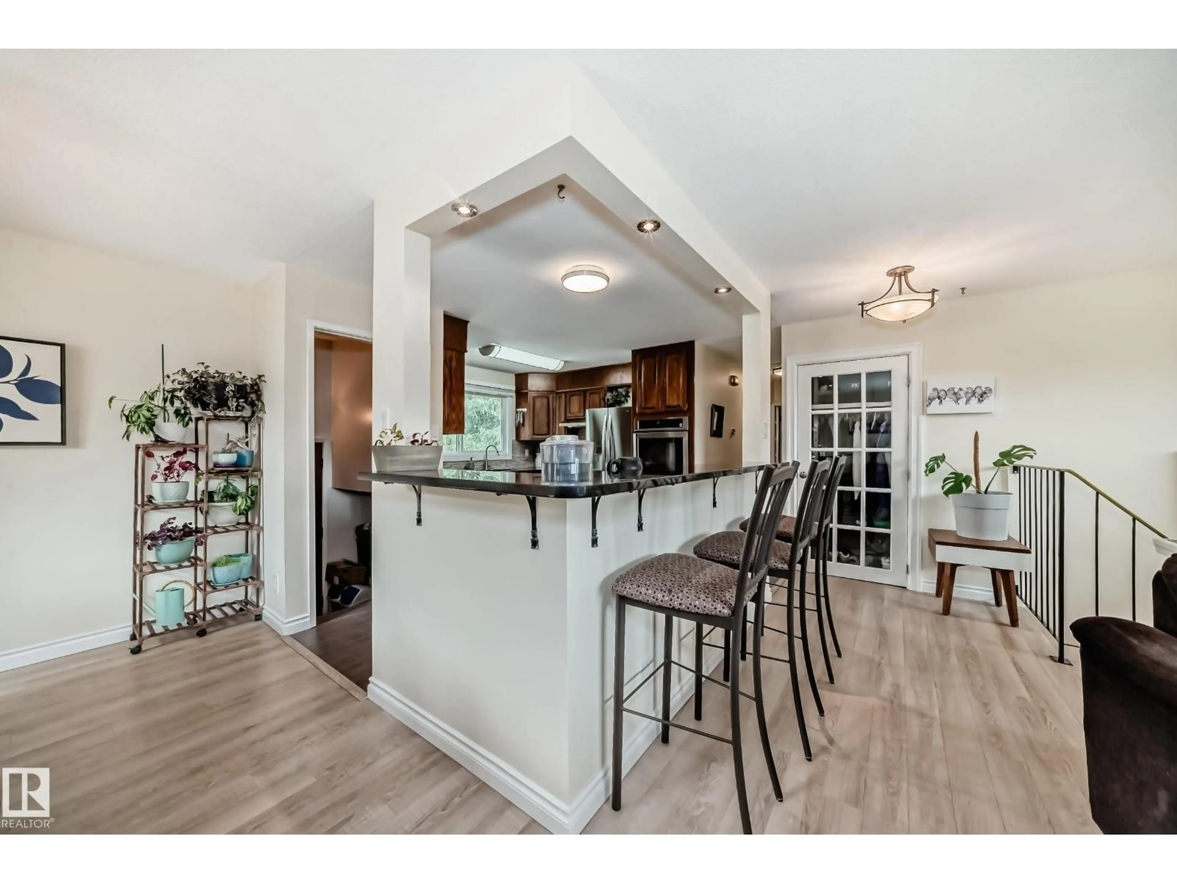 Open concept kitchen, wood/laminate floor for NW - 9608 169 ST, Edmonton Alberta T5P3X2