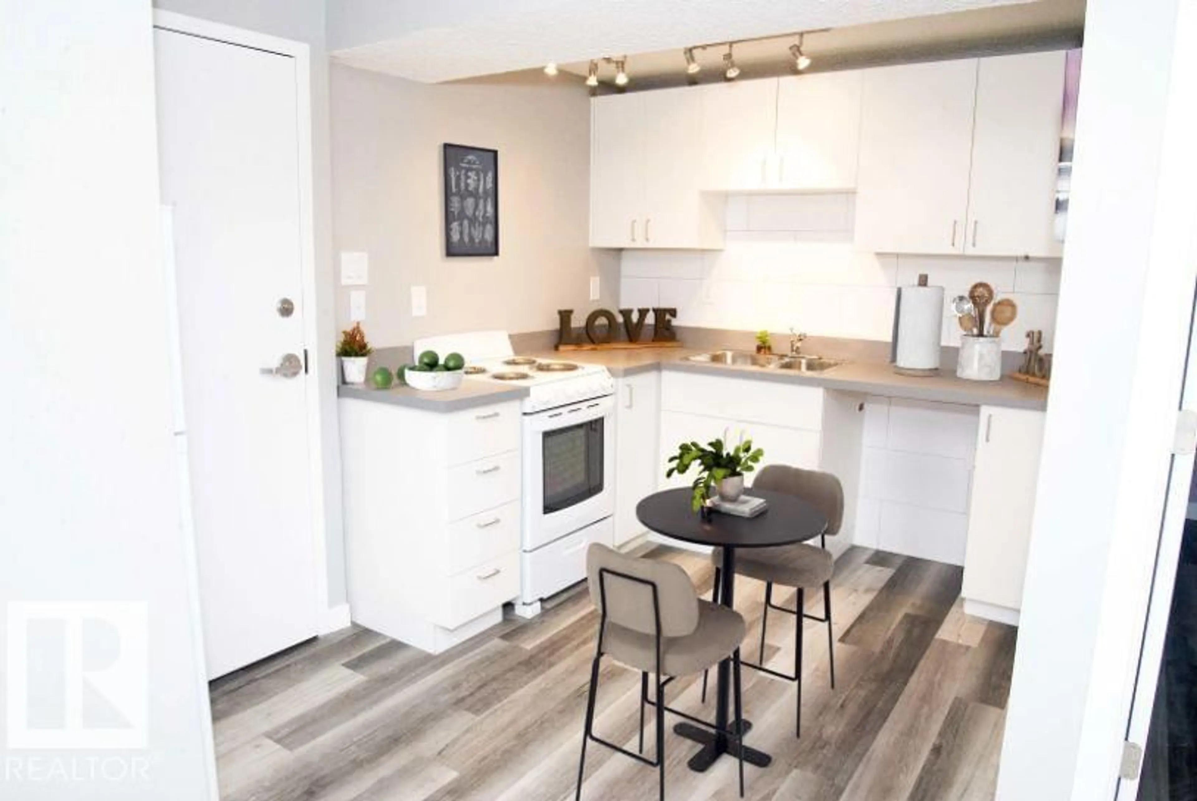 Open concept kitchen, wood/laminate floor for NW - 12730 113A ST, Edmonton Alberta T5E5B3