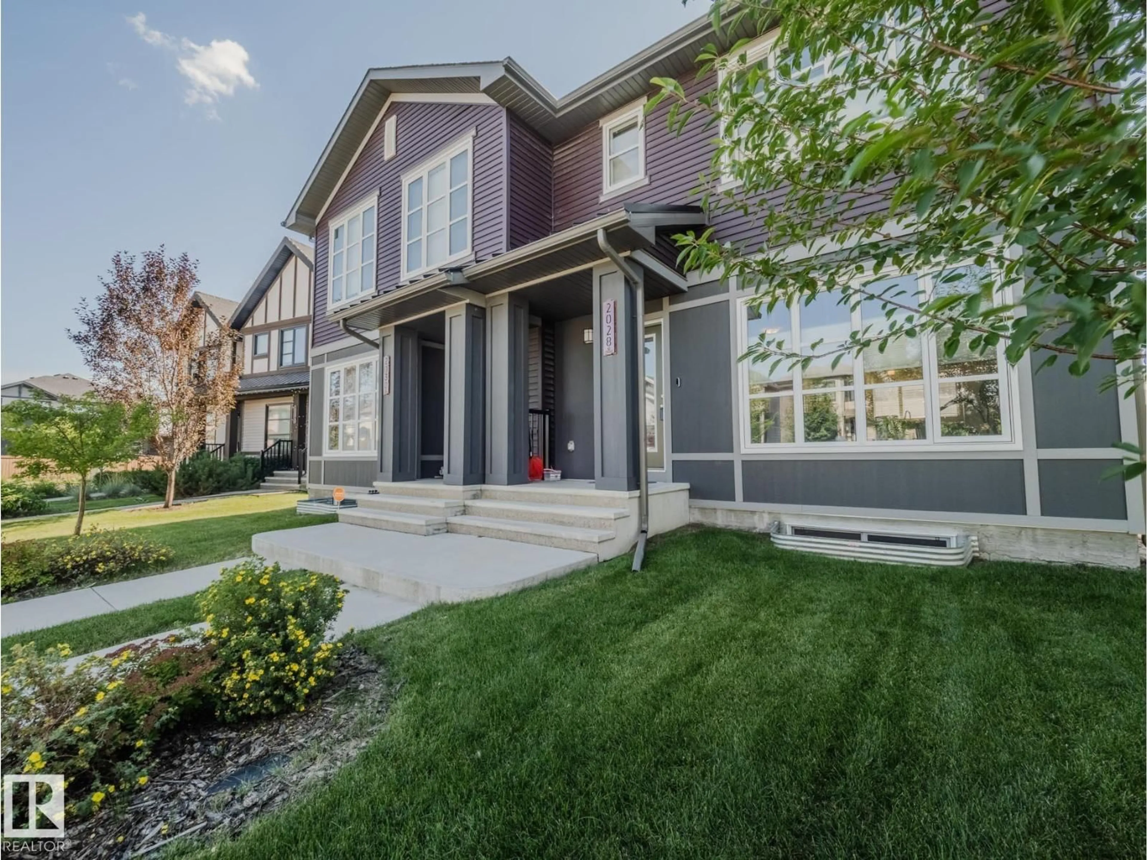 Home with vinyl exterior material, street for 2028 CAVANAGH DR, Edmonton Alberta T6W3M7