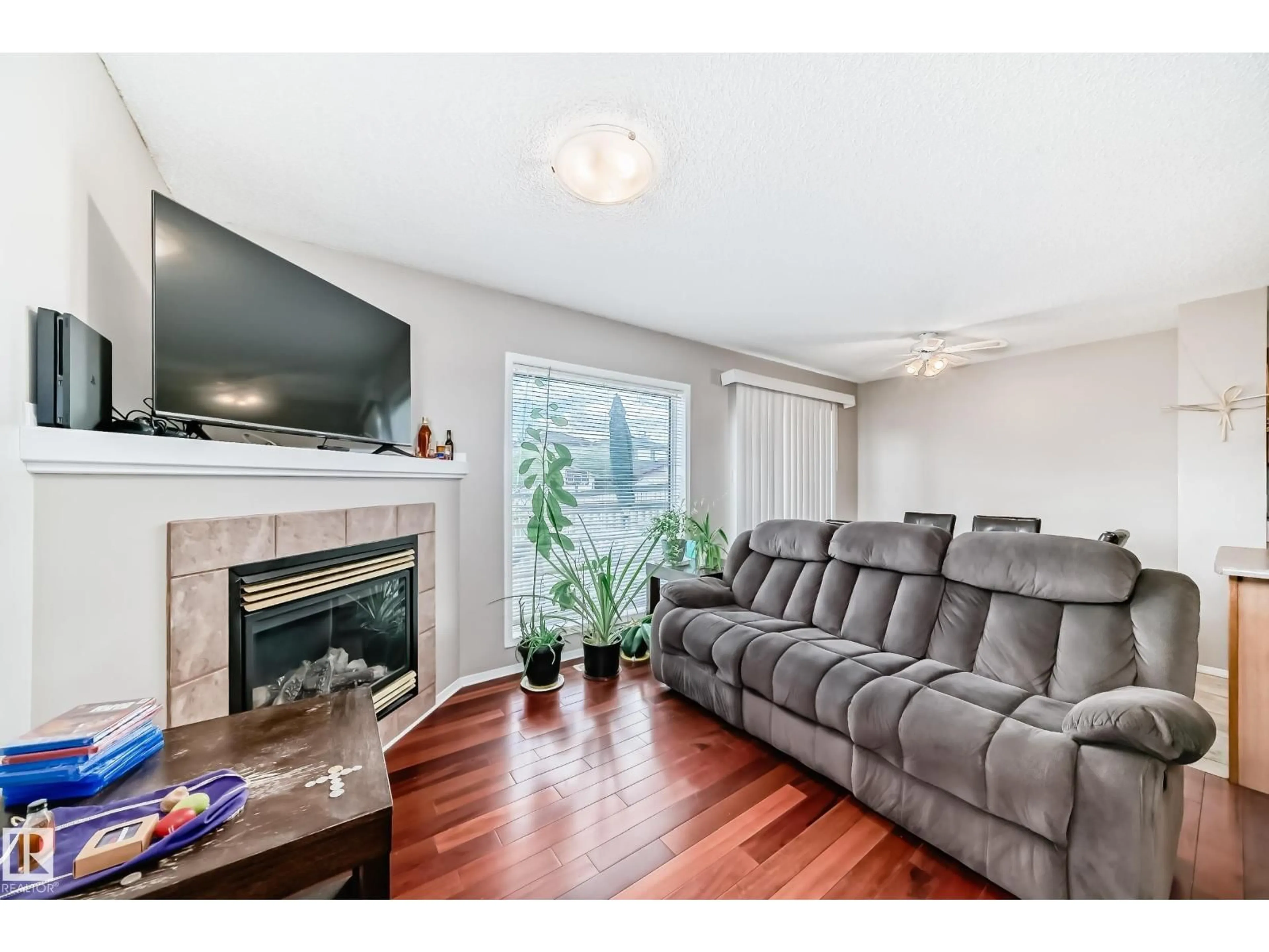 Living room with furniture, wood/laminate floor for NW - 3769 21 ST, Edmonton Alberta T6T1R7