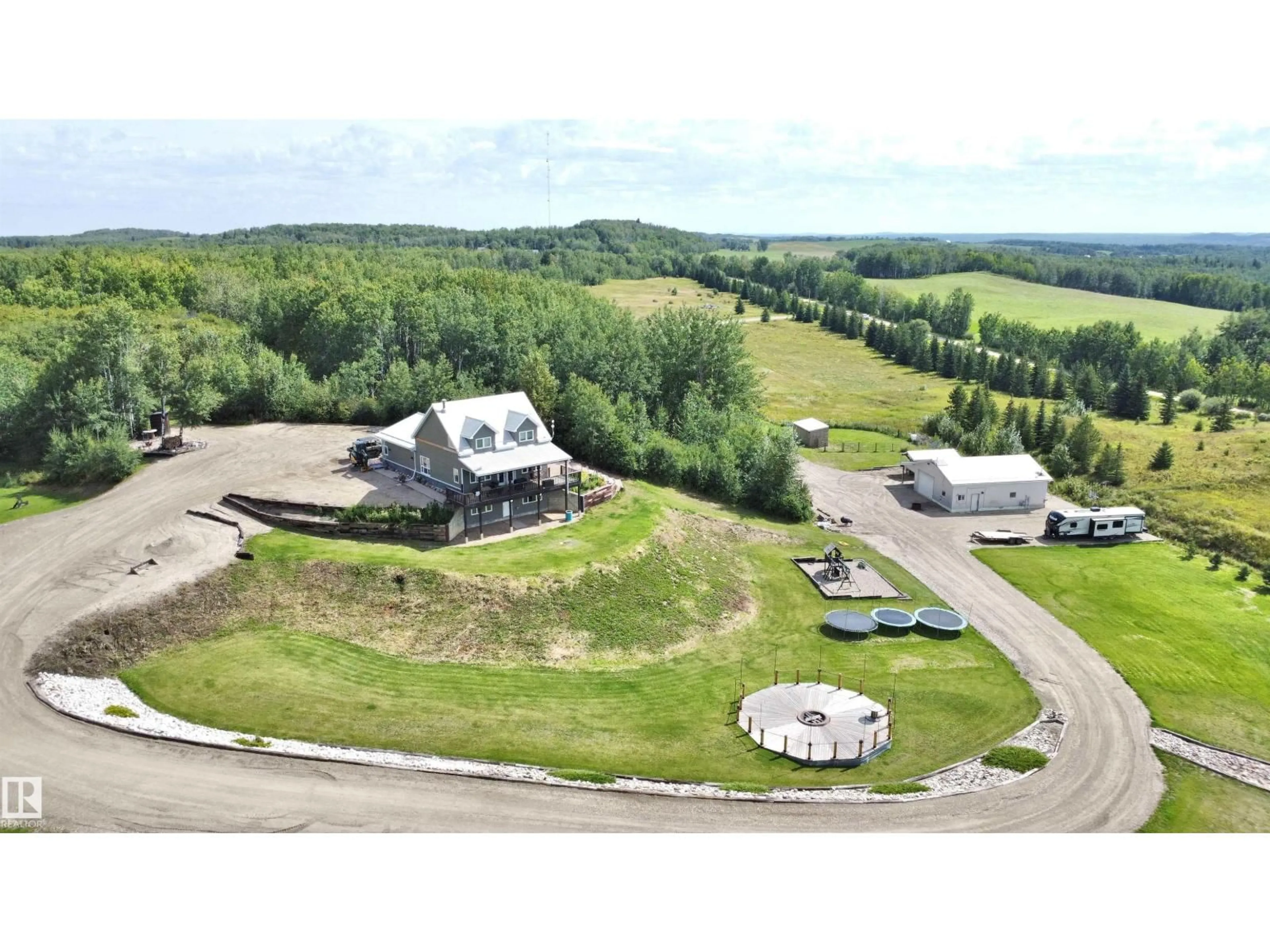 A pic from outside/outdoor area/front of a property/back of a property/a pic from drone, mountain view for 5208 TWP ROAD 505, Rural Parkland County Alberta T0E0N0