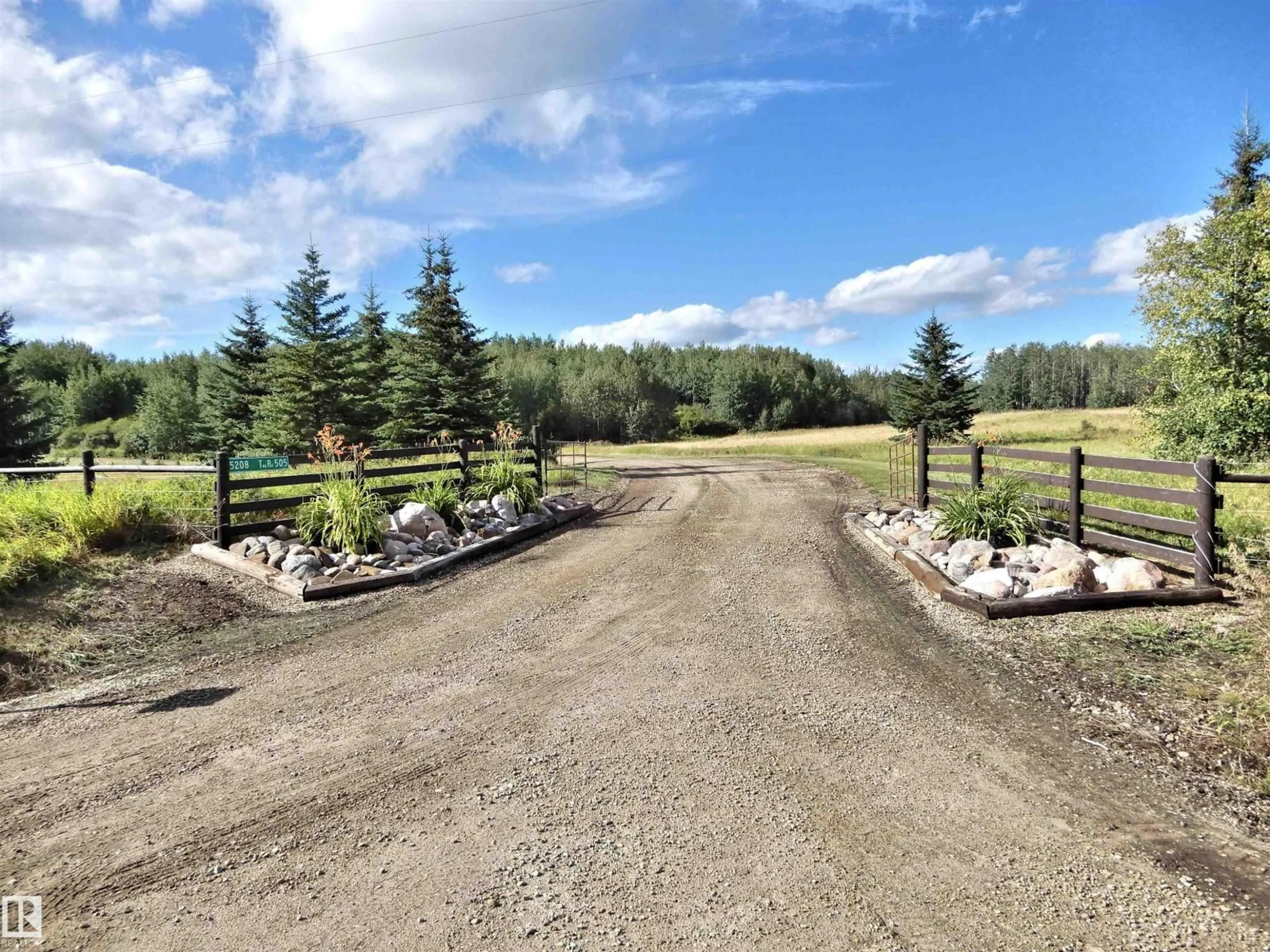 A pic from outside/outdoor area/front of a property/back of a property/a pic from drone, mountain view for 5208 TWP ROAD 505, Rural Parkland County Alberta T0E0N0