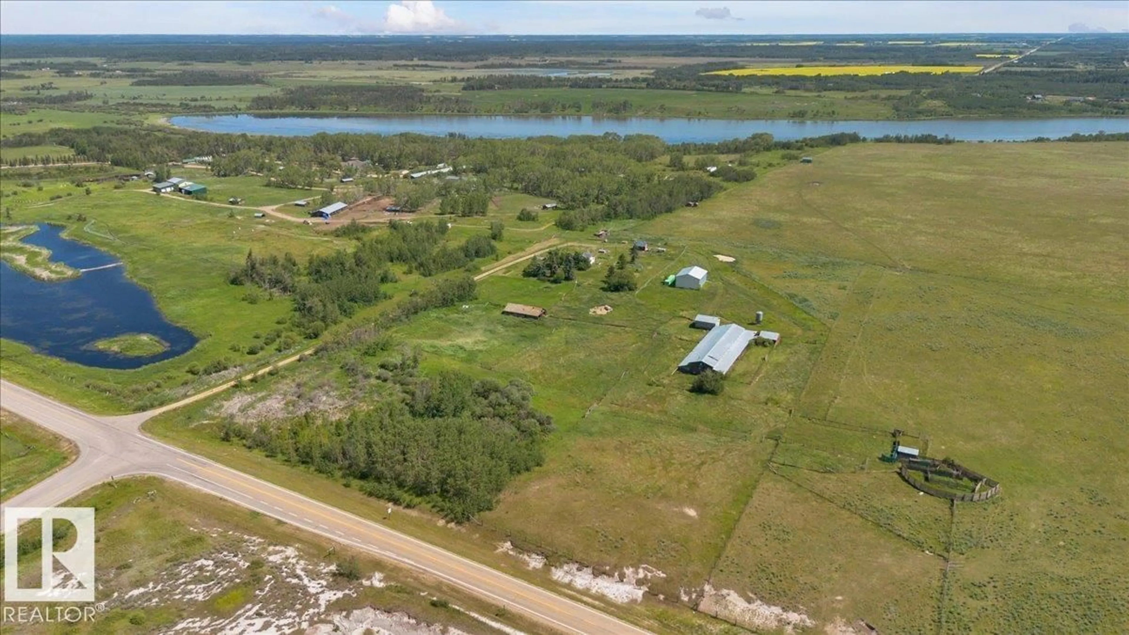 A pic from outside/outdoor area/front of a property/back of a property/a pic from drone, water/lake/river/ocean view for 23427 TWP RD 574, Rural Sturgeon County Alberta T8R1L2