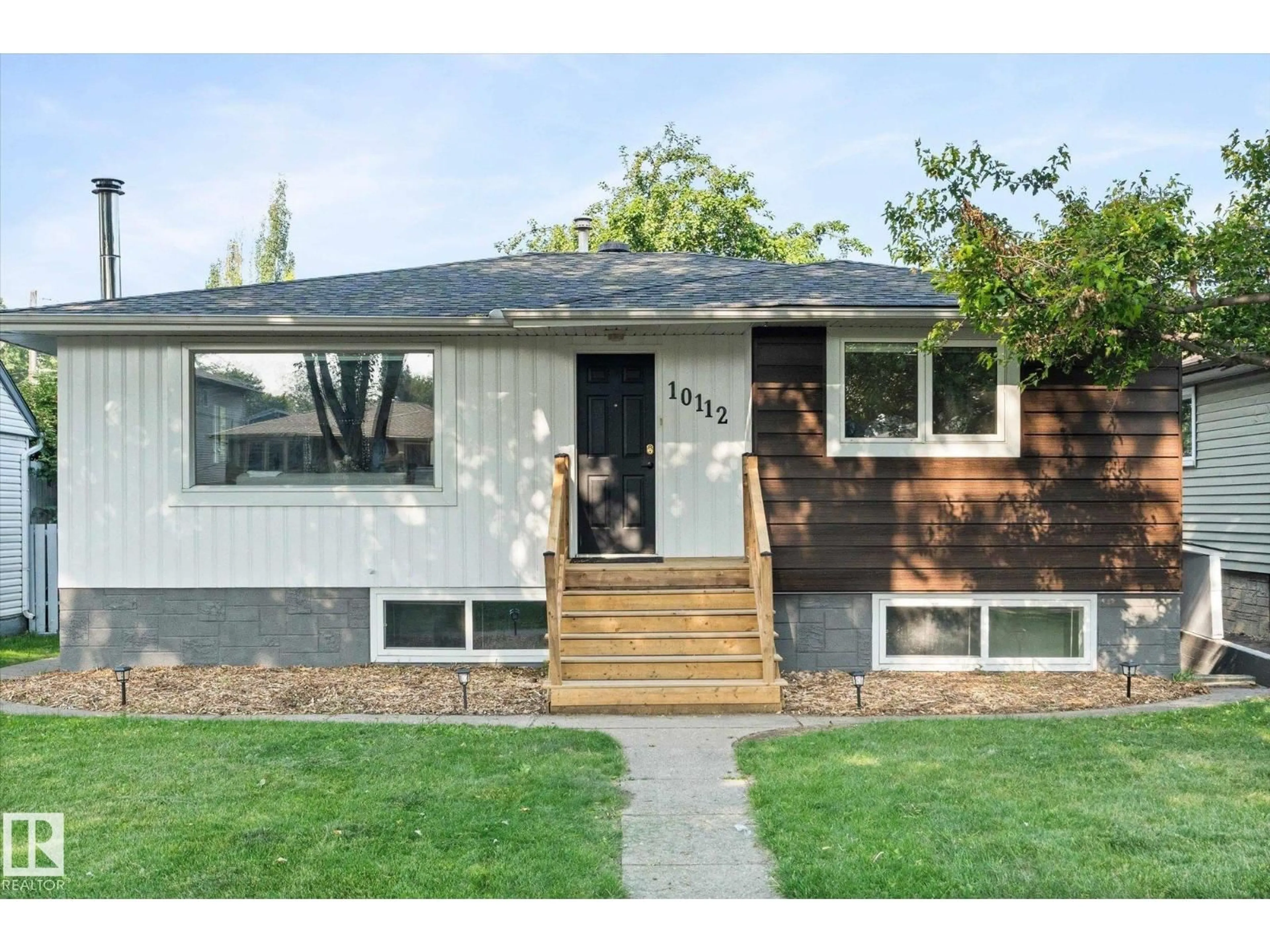 Home with vinyl exterior material, street for 10112 81 ST, Edmonton Alberta T6A3K5