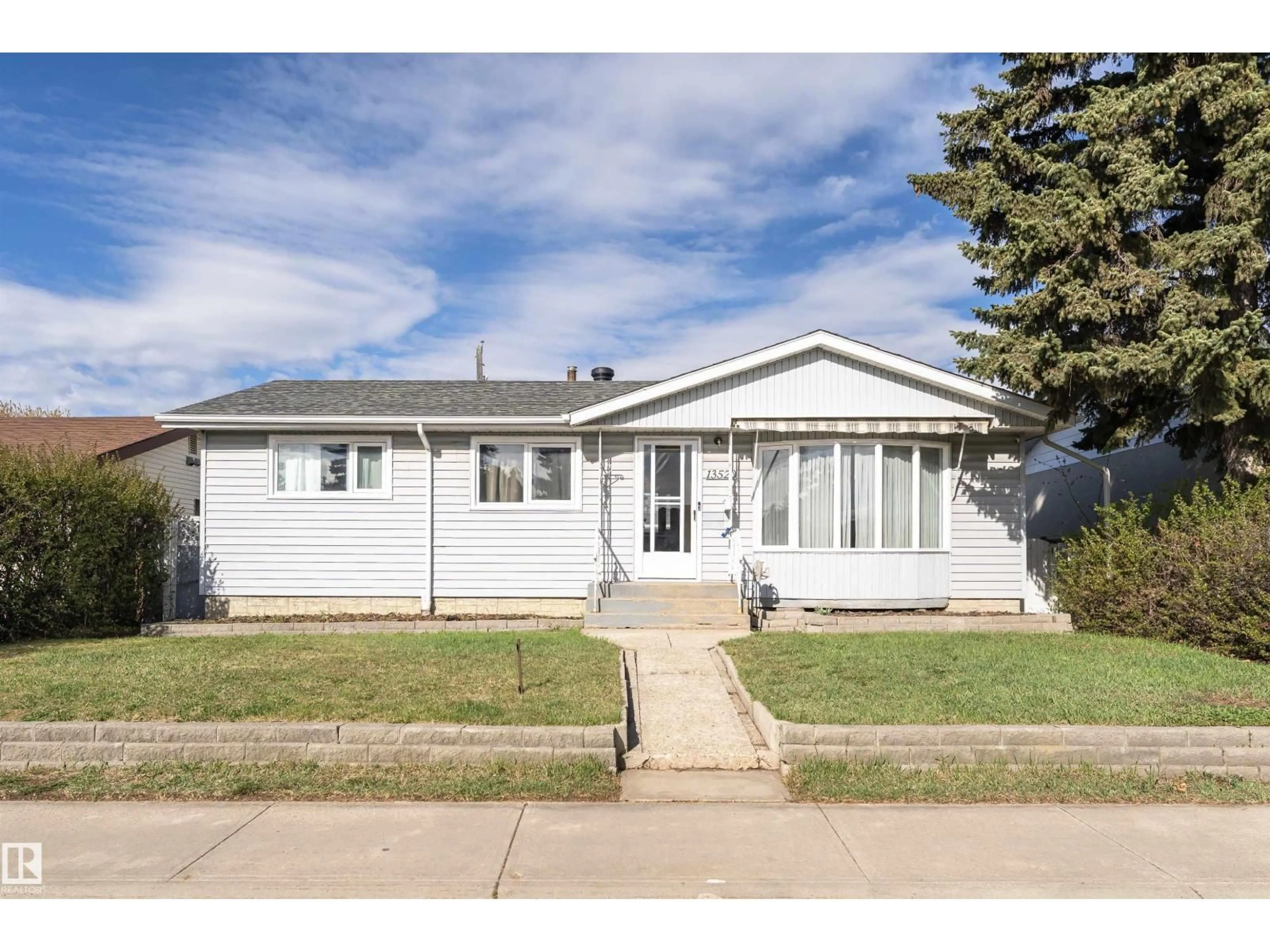 Home with vinyl exterior material, street for 13520 113A ST NW, Edmonton Alberta T5E5C4