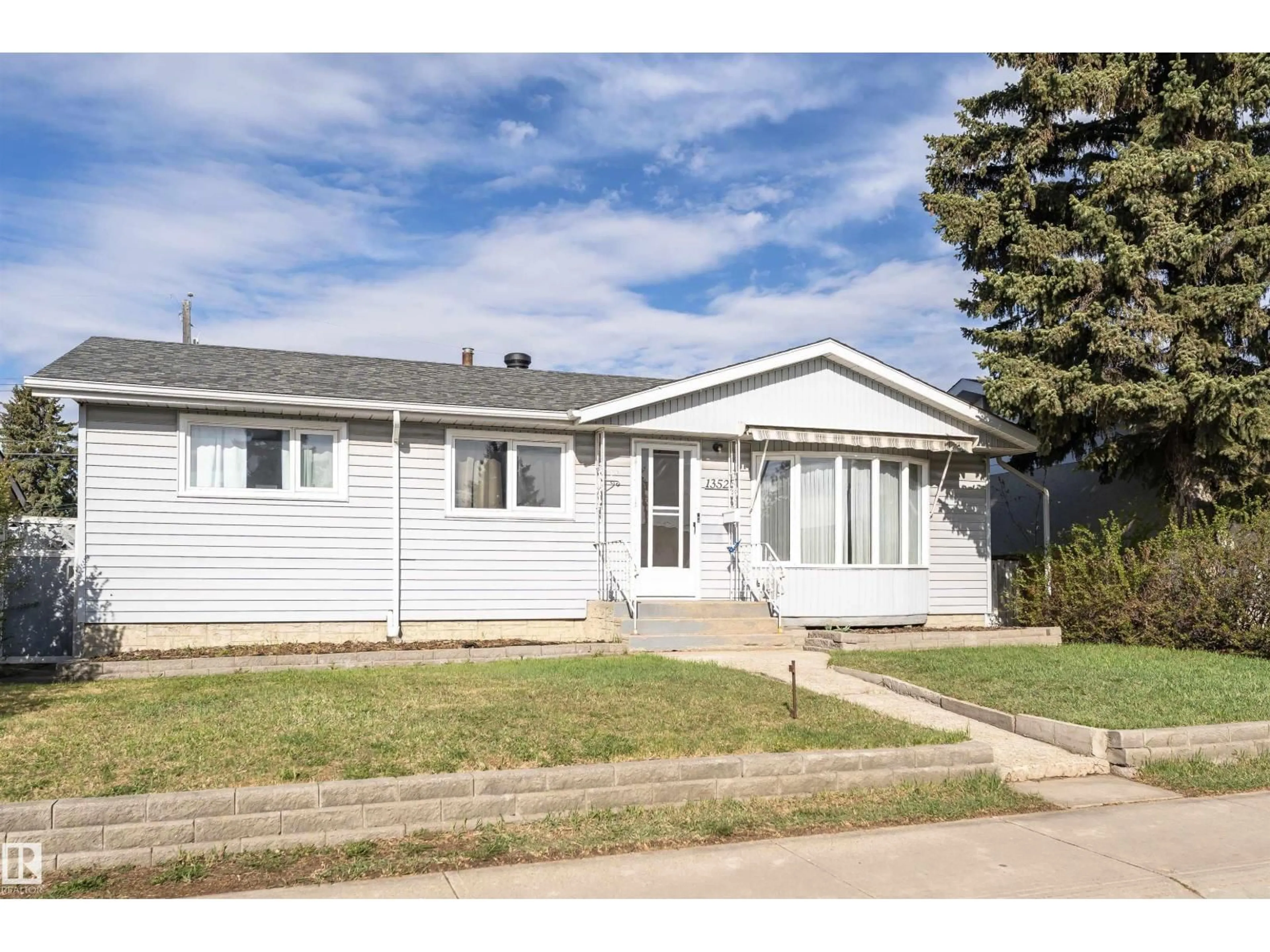 Home with vinyl exterior material, street for 13520 113A ST NW, Edmonton Alberta T5E5C4